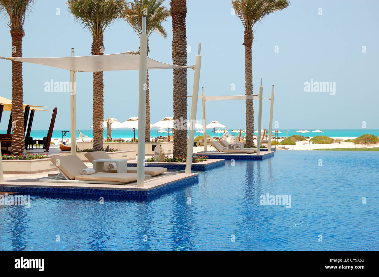 Swimming pool near beach at the luxury hotel, Saadiyat island, Abu Dhabi, UAE Stock Photo