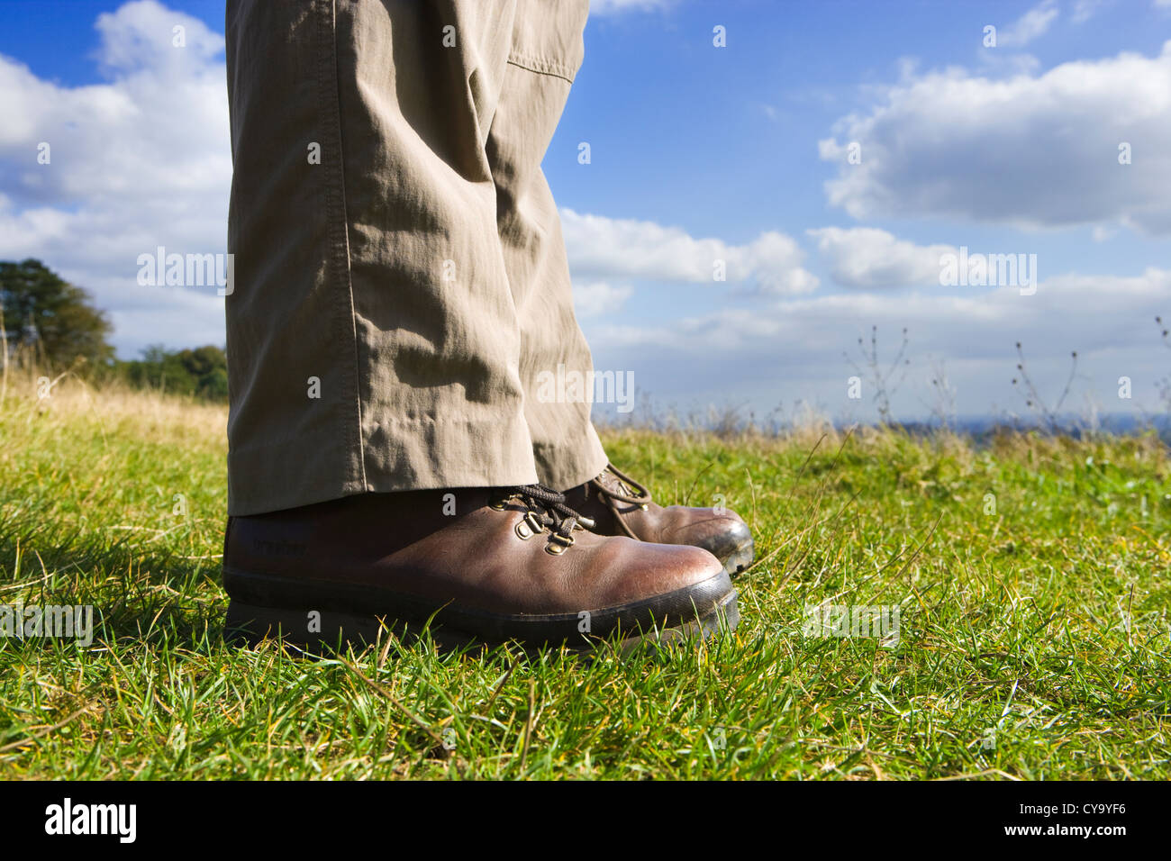 Person in walking boots, standing. Stock Photo