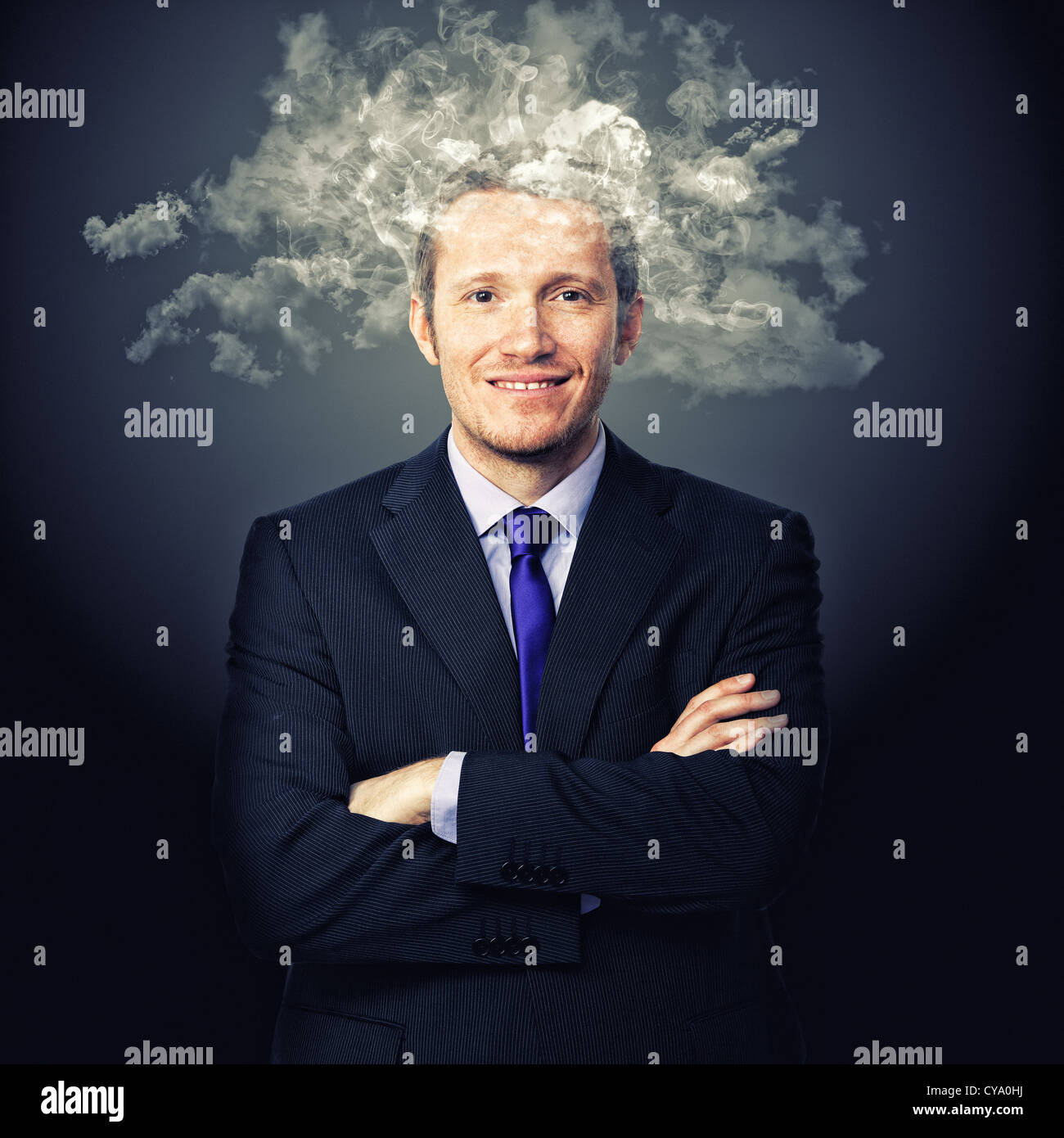 portrait of businessman with smoke on his head Stock Photo