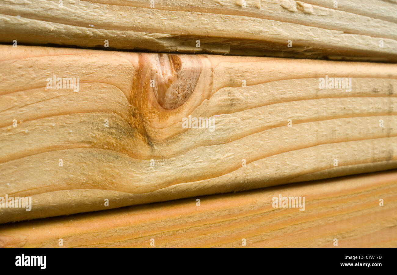 A tight shot of lumber loaded onto a train for transport Stock Photo