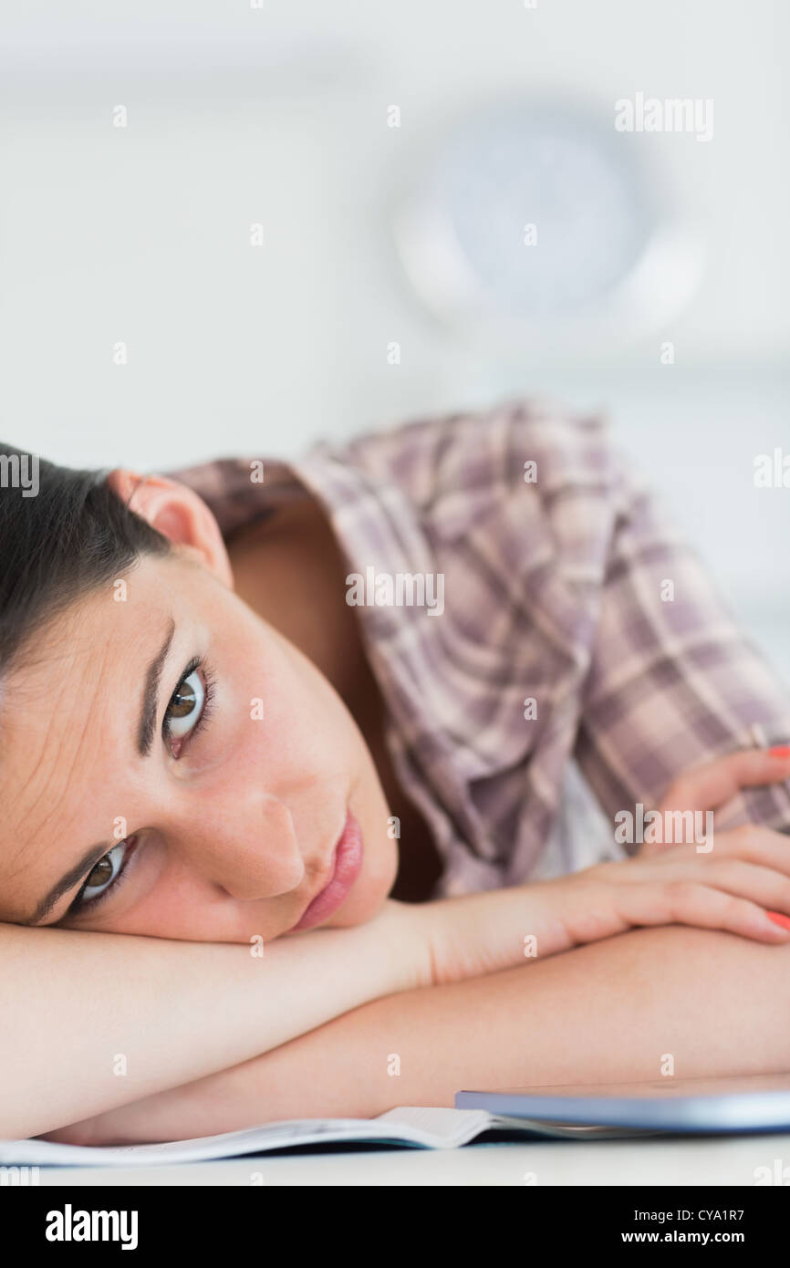 Woman leaning on the table with arms crossed Stock Photo Alamy