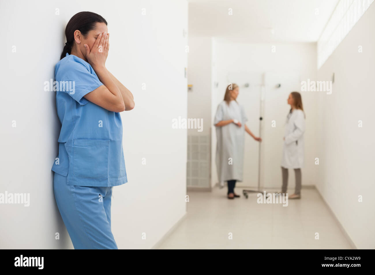 Distressed nurse with patient hi-res stock photography and images - Alamy