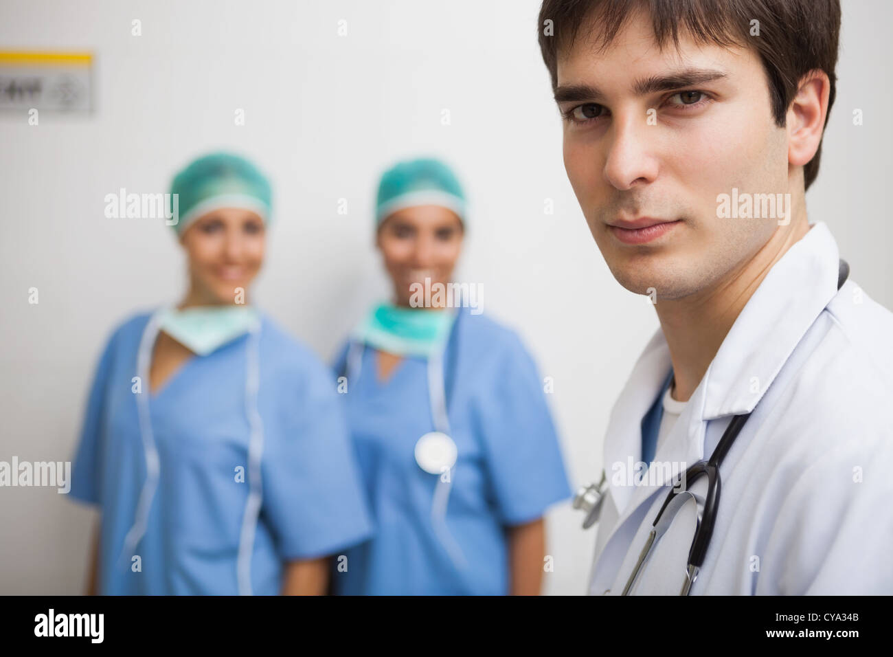 Satisfied doctor with two nurses Stock Photo