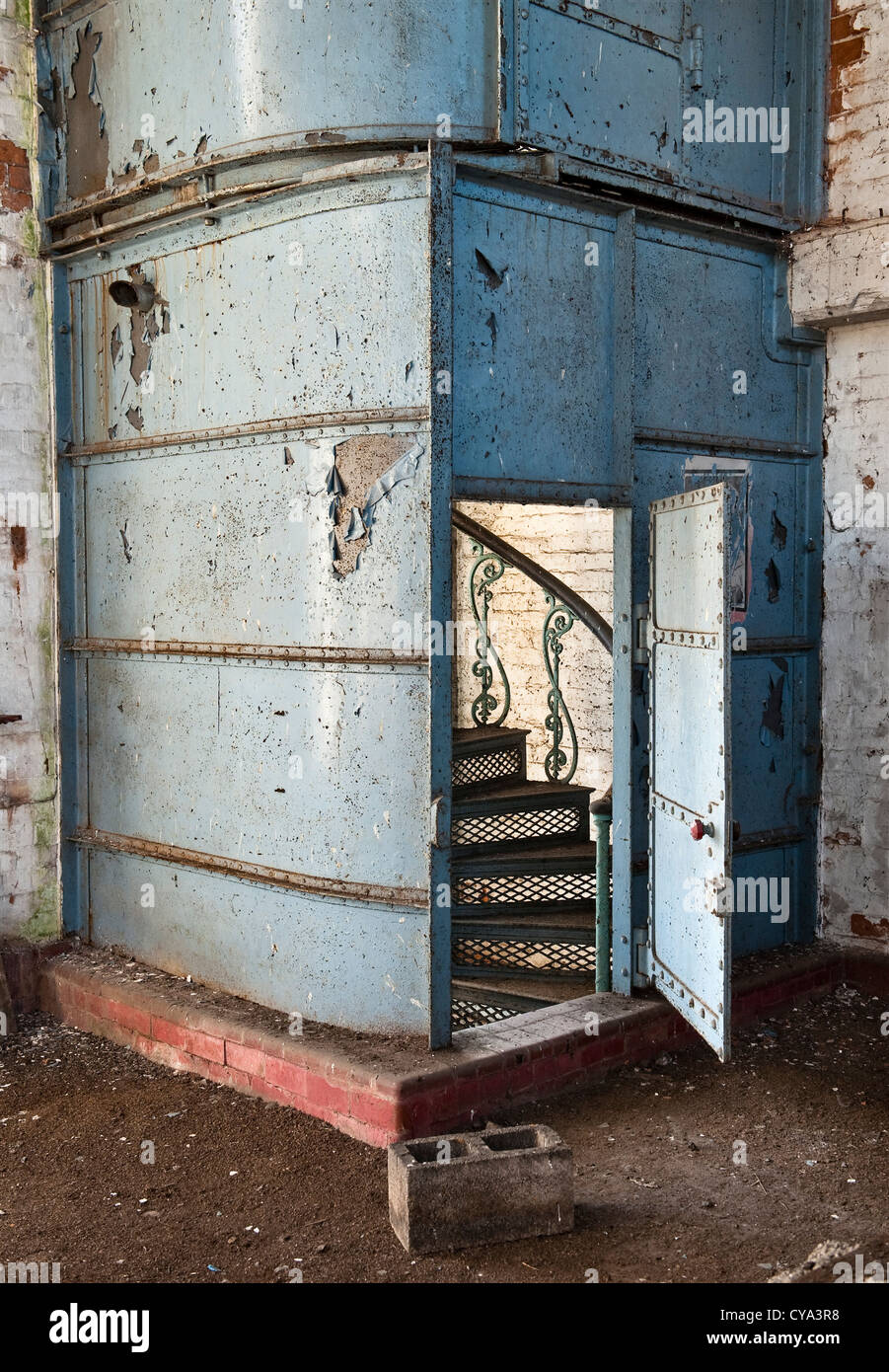 A castiron fireproof spiral stair runs from top to bottom of the