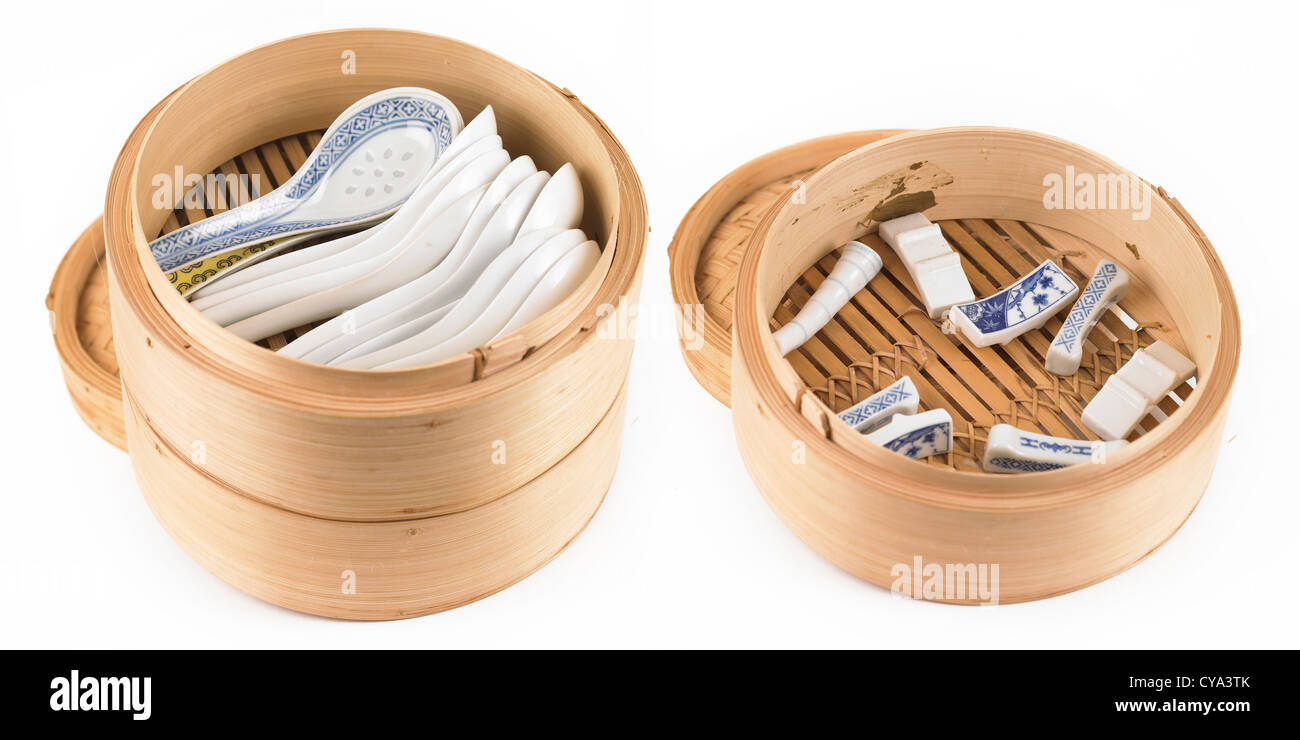 Chinese rice steamer with soup spoons and chopstick stands Stock Photo