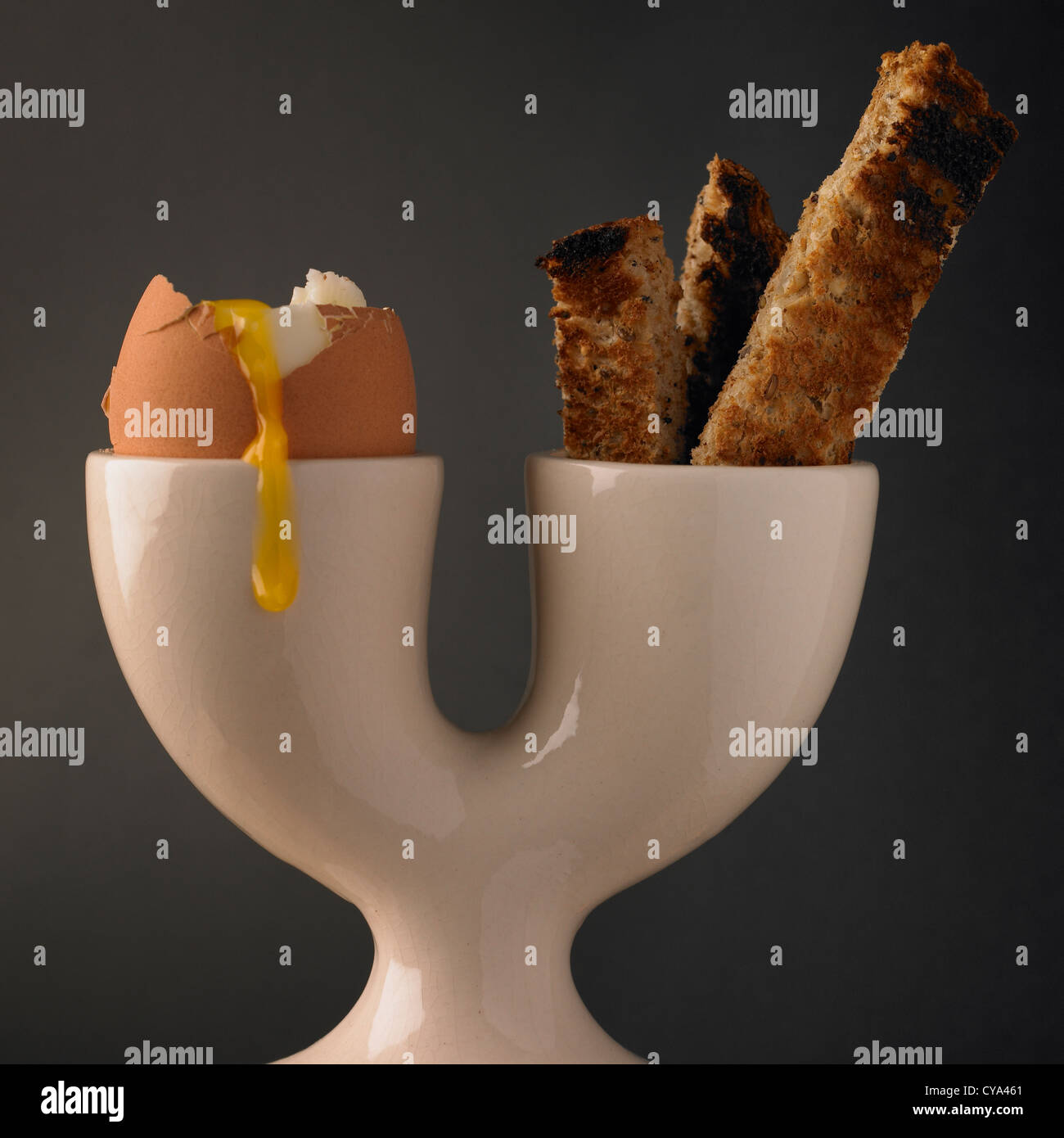 Breakfast soft boiled egg and soldiers of toast in a double eggcup Stock Photo