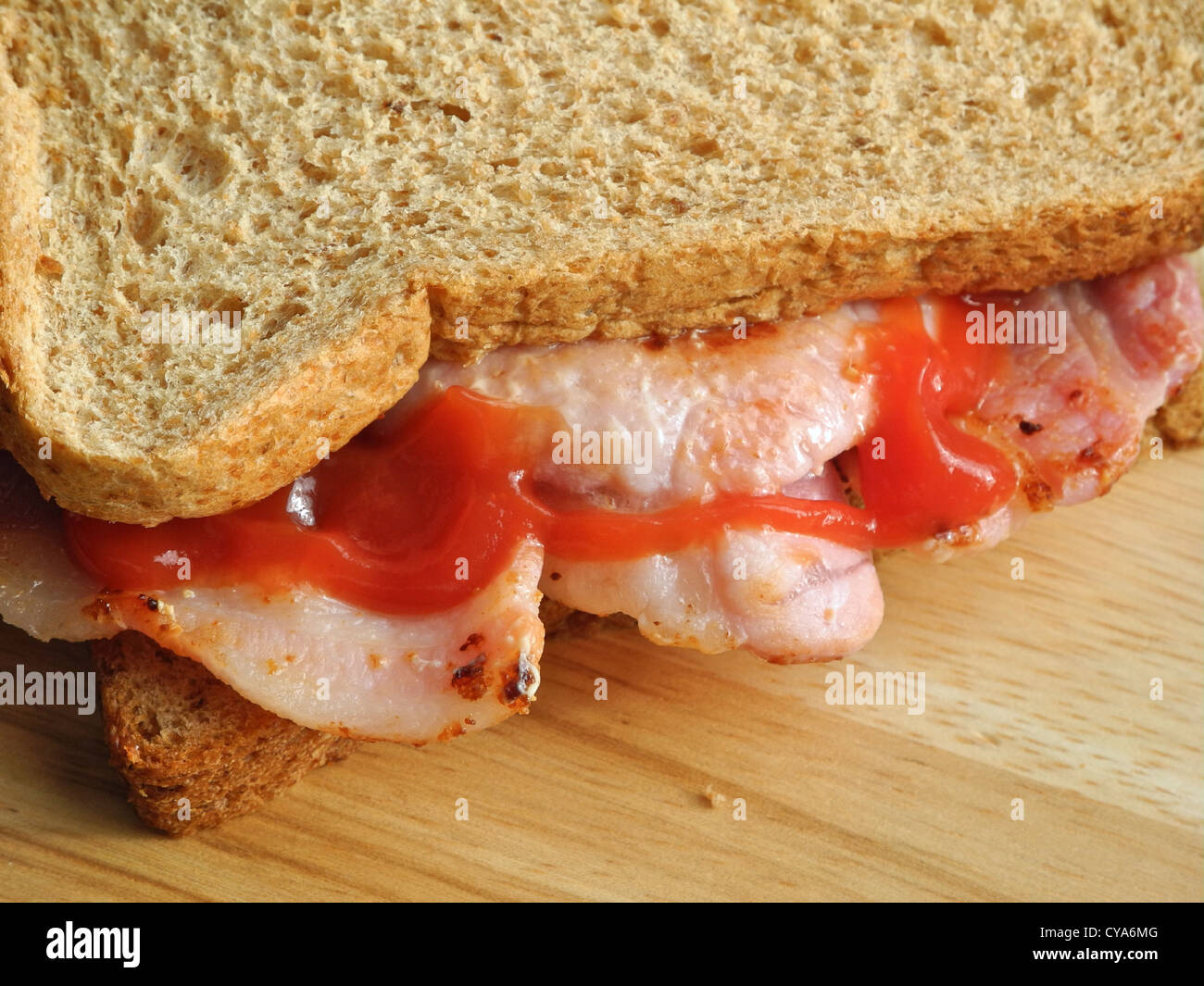 A Bacon Sandwich with tomato sauce Stock Photo