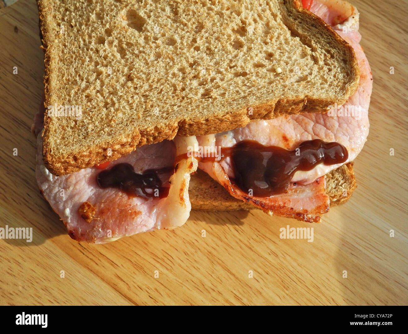A Bacon Sandwich with brown sauce Stock Photo Alamy
