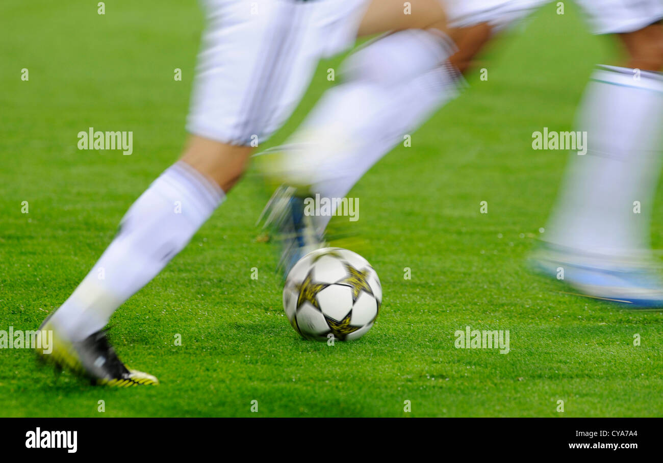 football players run by UEFA Champions League Balls Adidas Finale 12 OMB on  football pitch Stock Photo - Alamy