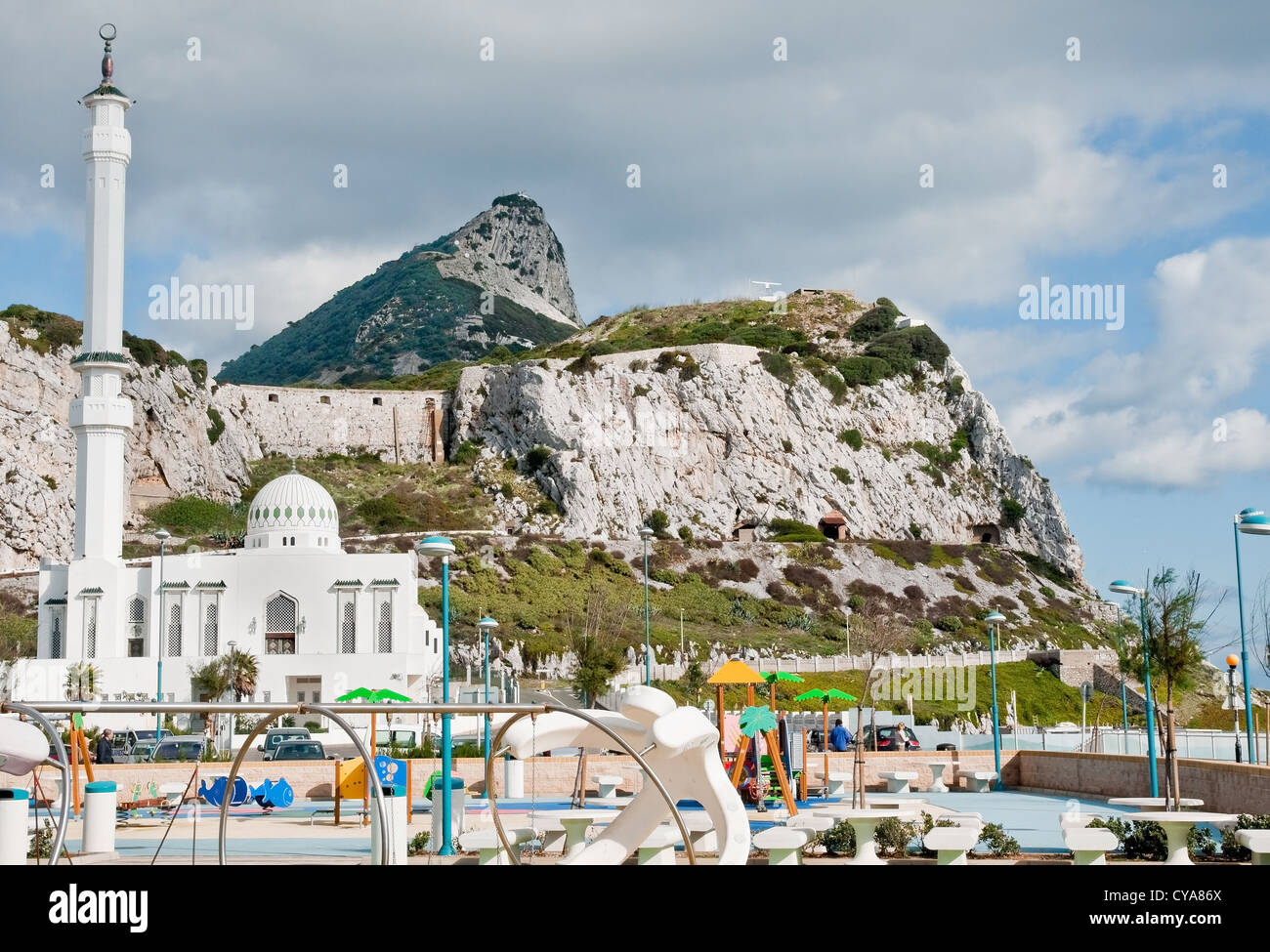 The Rock of Gibraltar seen from its southern tip at Europa Point. Newly-built mosque and children's play area in the foreground. Stock Photo