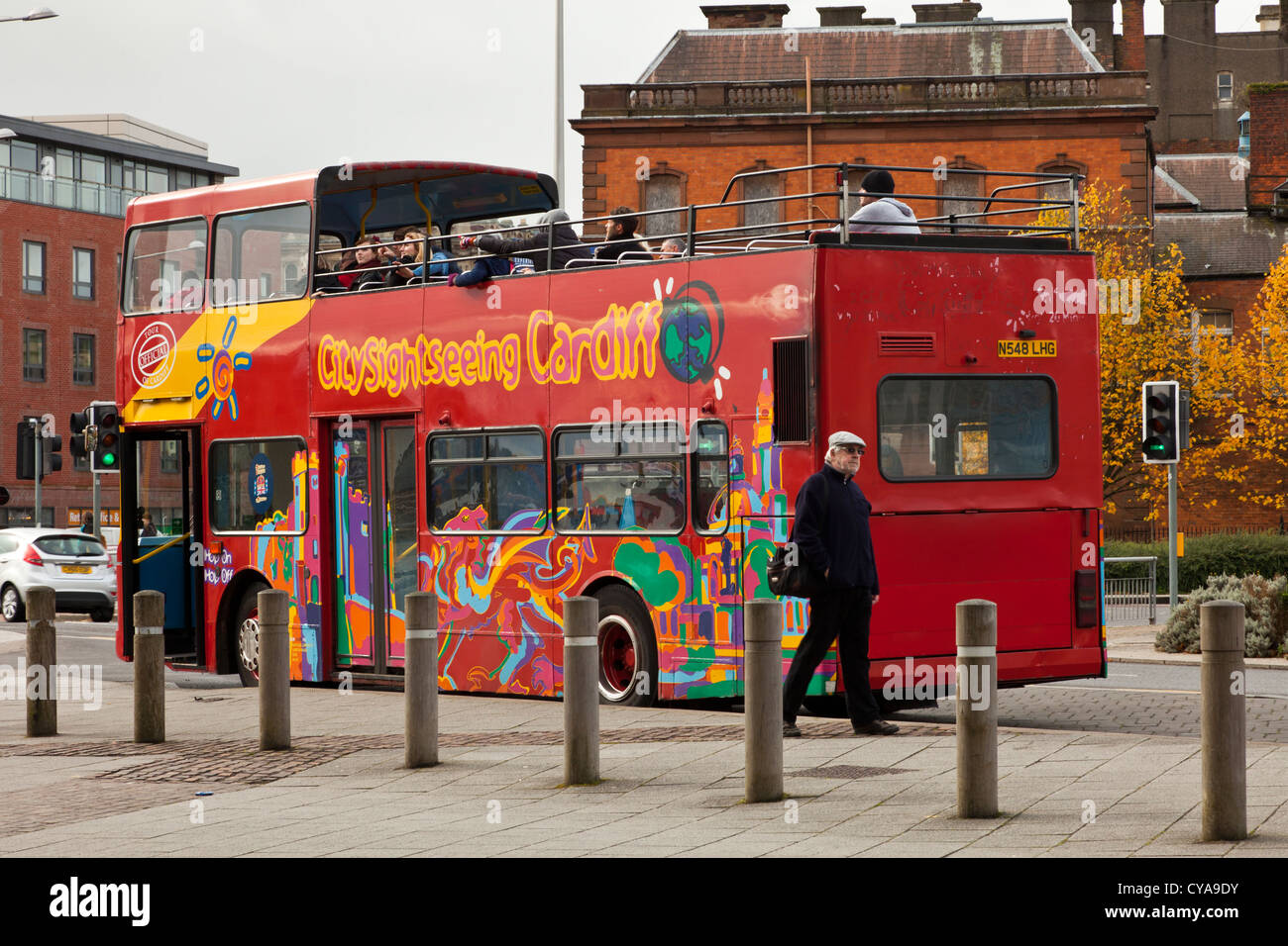 Open topped city sight seeing tour bus in Cardiff bay. Stock Photo