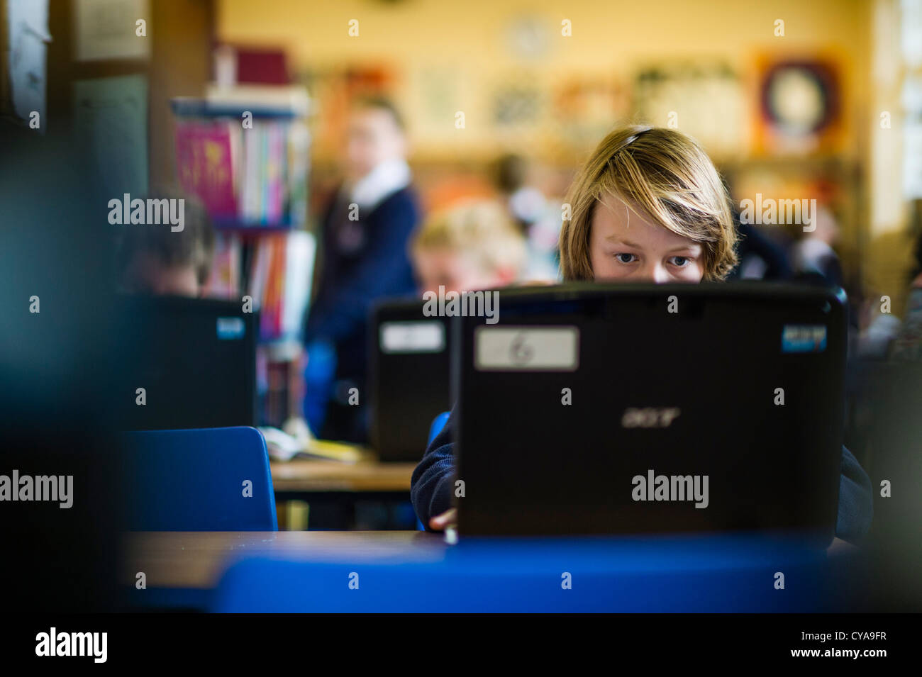 Pupils using information technology computers in a secondary