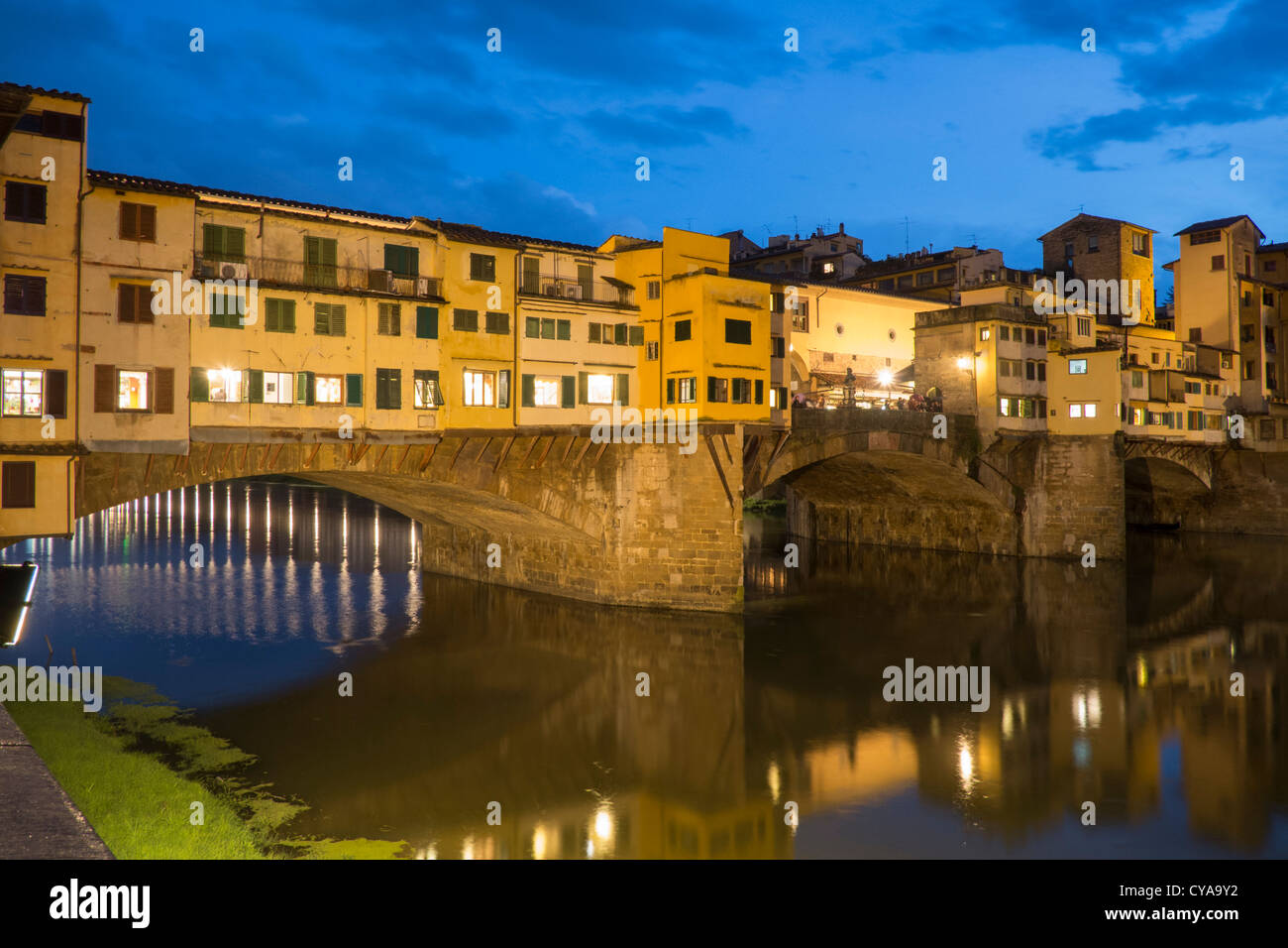 Evening view of historic ponte Vecchio bridge over Arno River in Florence Italy Stock Photo