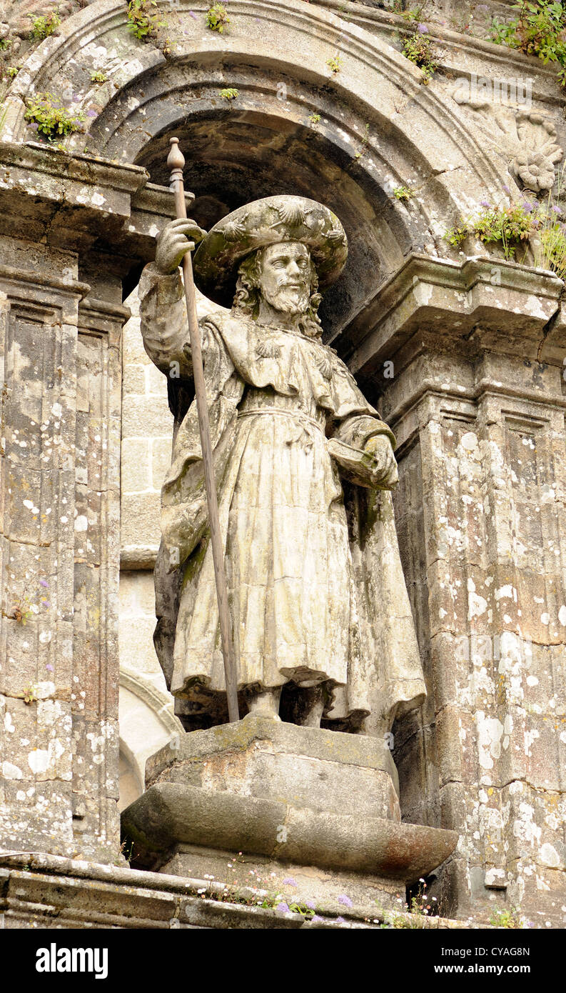 Stautue of a pilgrim above an entrance to  Santiago Cathedral. . Santiago de Compostela, Galicia, Spain. Stock Photo