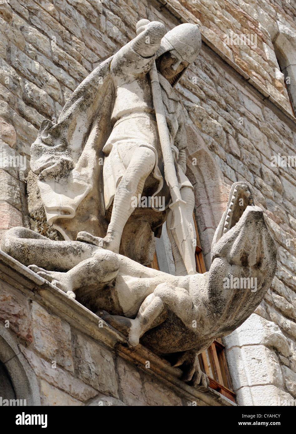 Statue on the front of Casa de Botines of St George killing the dragon. Casa de Botines was designed by Antoni Gaudi  Leon. Stock Photo
