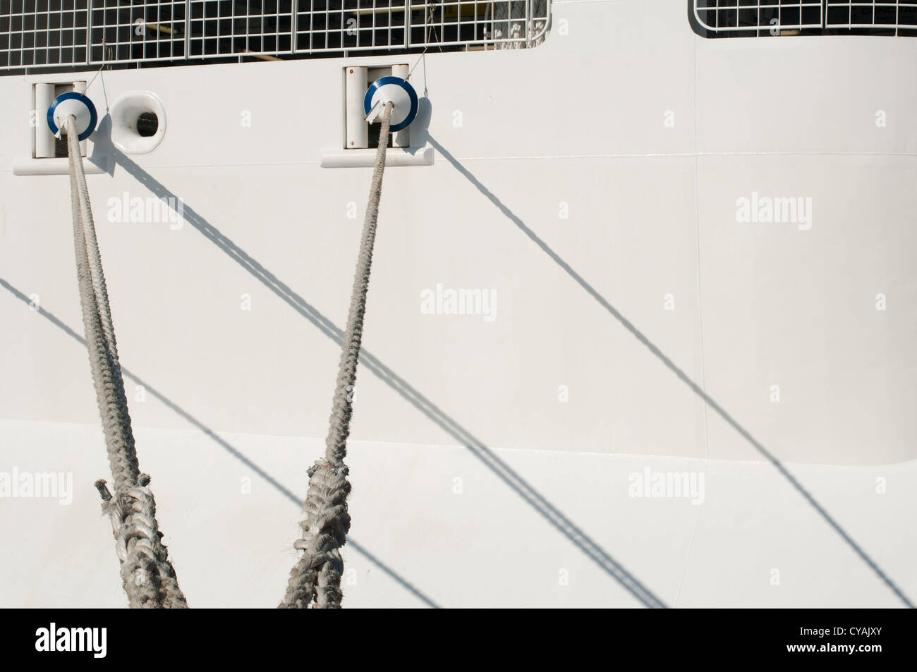 Ship ropes and moored ship close up Stock Photo - Alamy