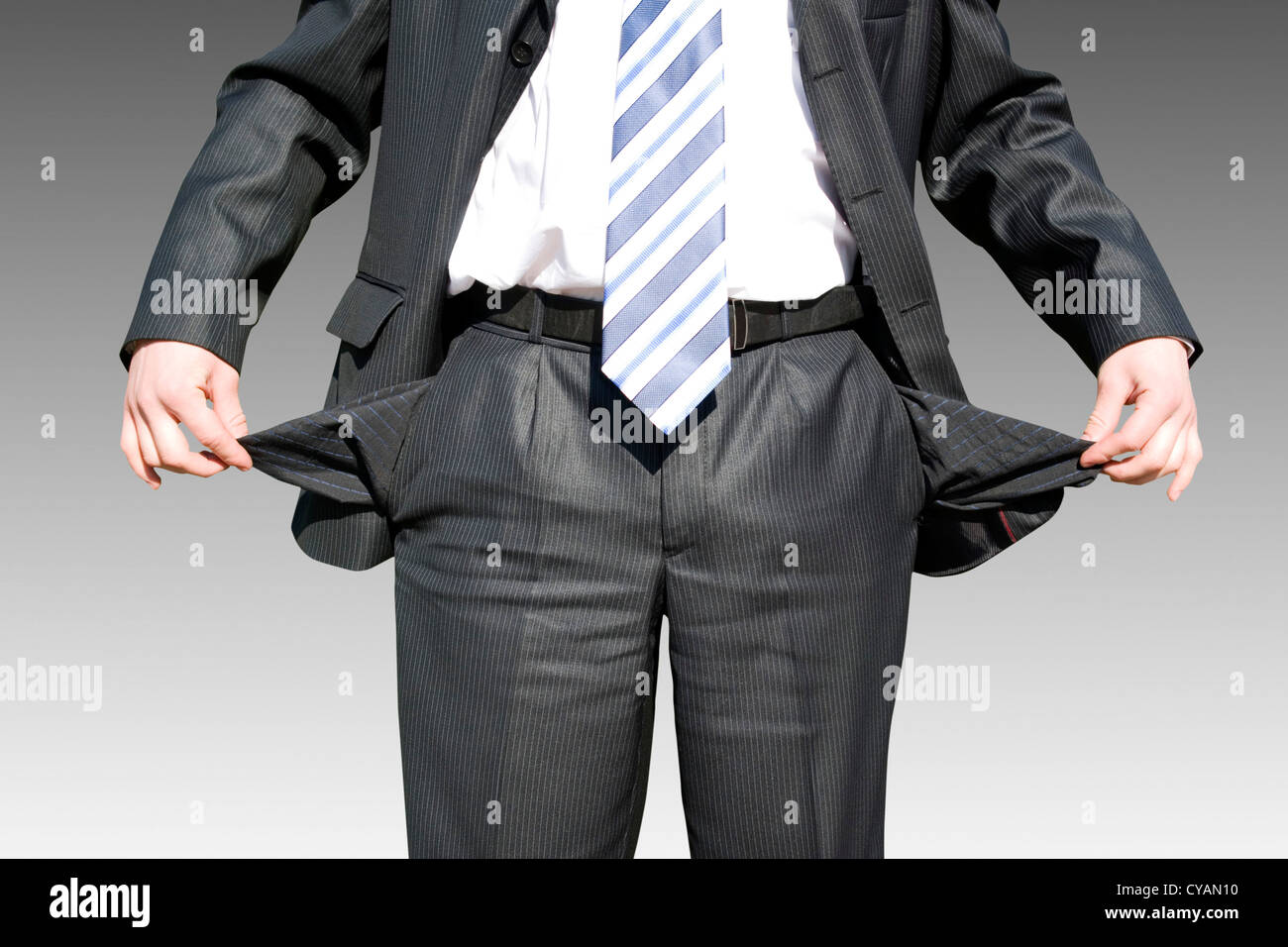 Businessman with empty pockets on white Stock Photo