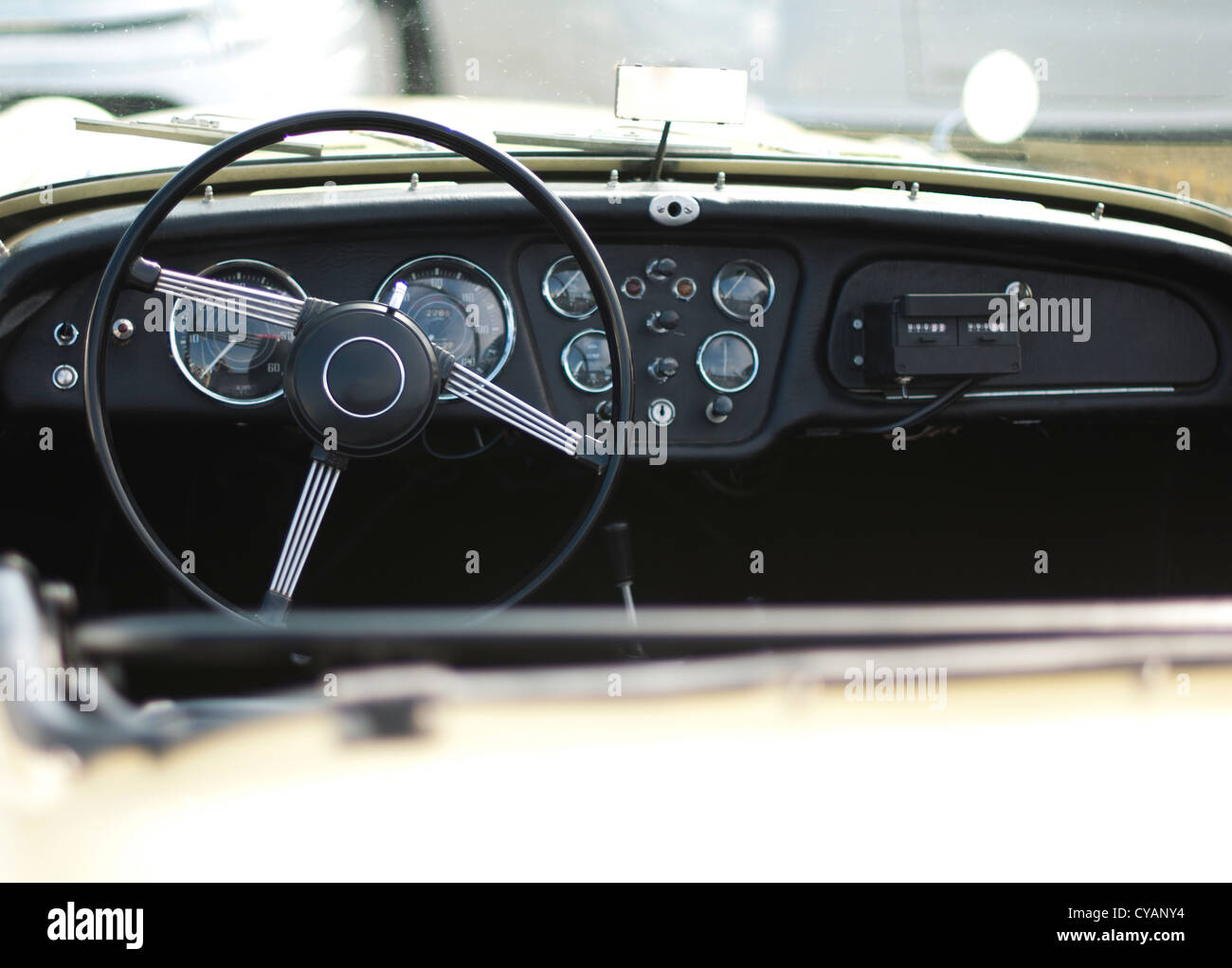 Steering wheel and dashboard of an old antique car. Stock Photo