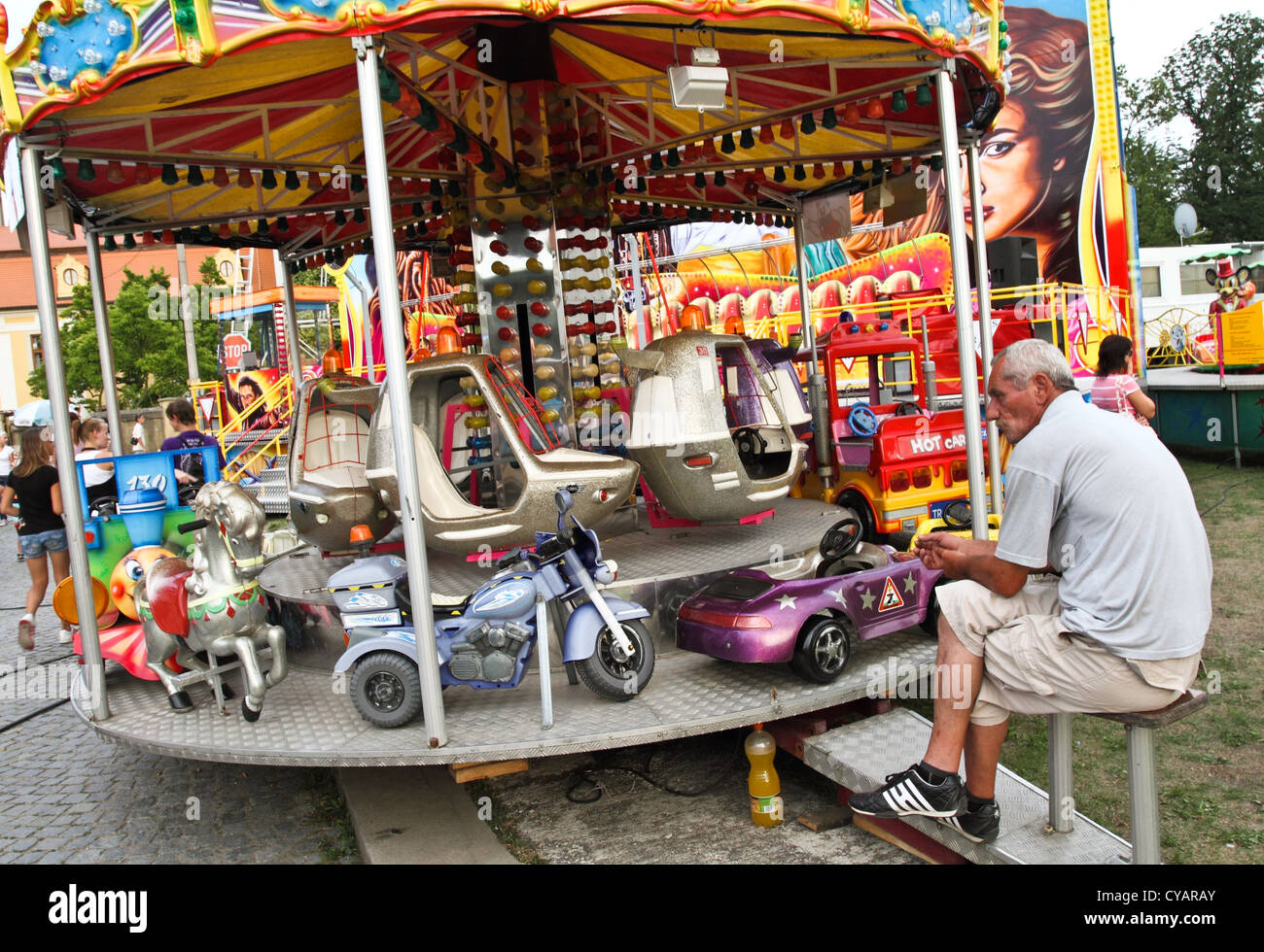 man at carousel Stock Photo