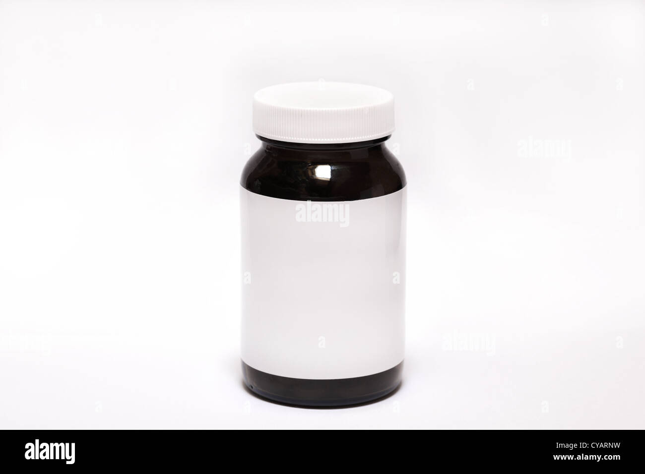 Plastic pill bottle with white empty etiquette on white Stock Photo