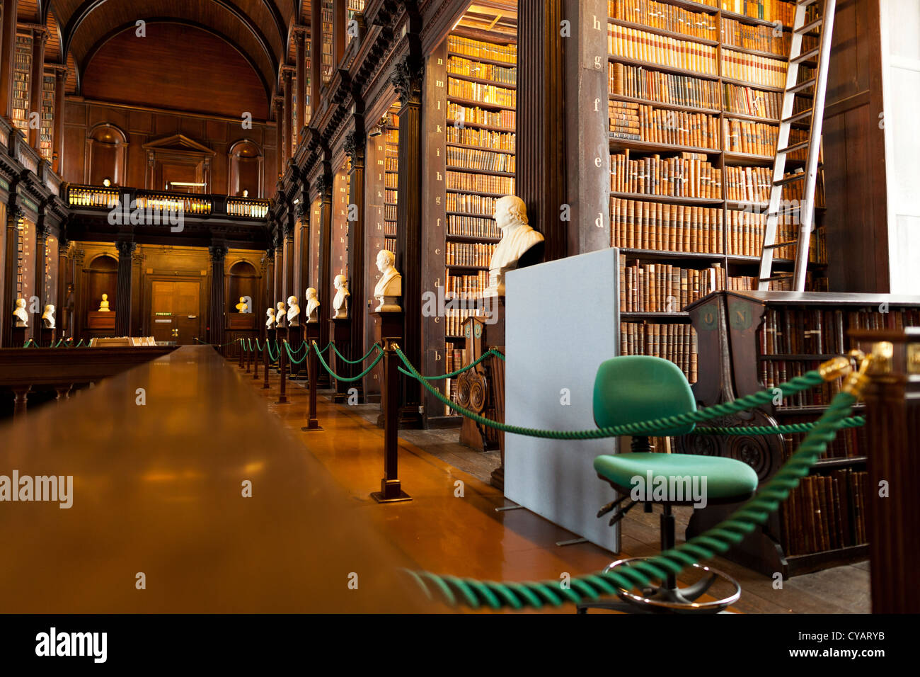 The long room in Trinity College, Dublin, where the book of Kells is kept along with over 200,000 other ancient books. Stock Photo