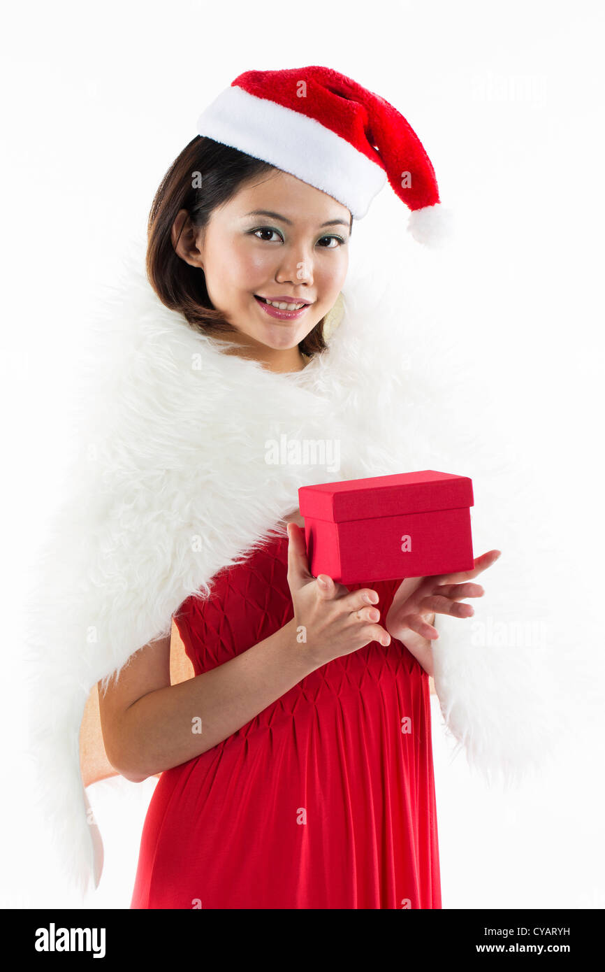 Happy Chinese 'Christmas' girl wearing a santa hat Stock Photo - Alamy