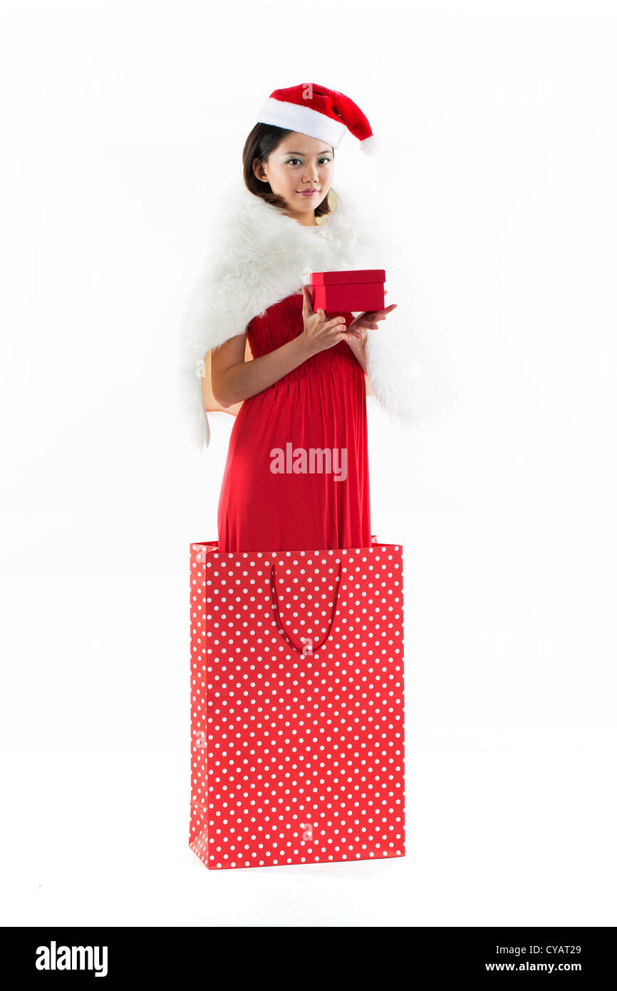 Happy Chinese 'Christmas' girl wearing a santa hat Stock Photo