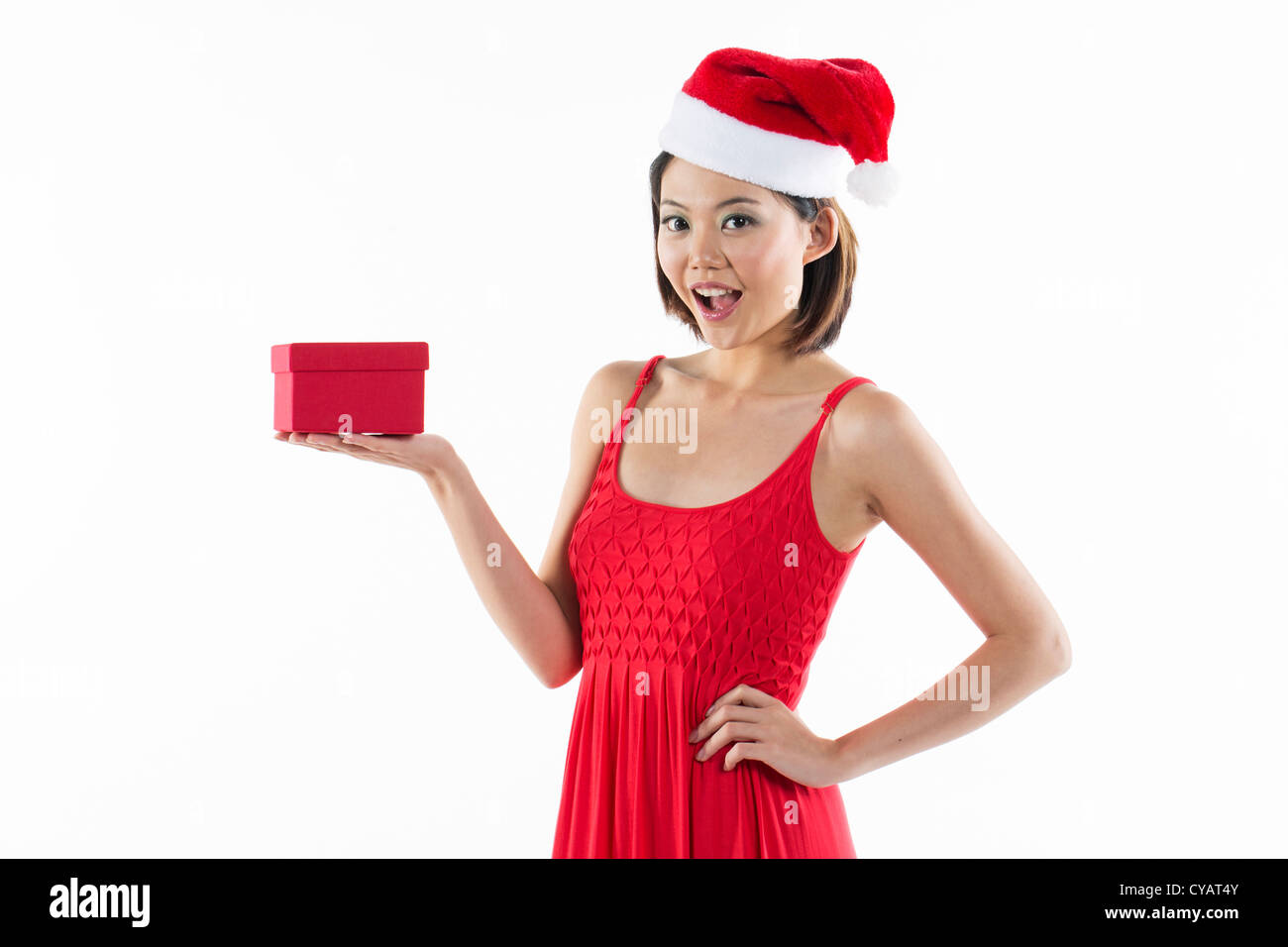 Happy Chinese 'Christmas' girl wearing a santa hat Stock Photo