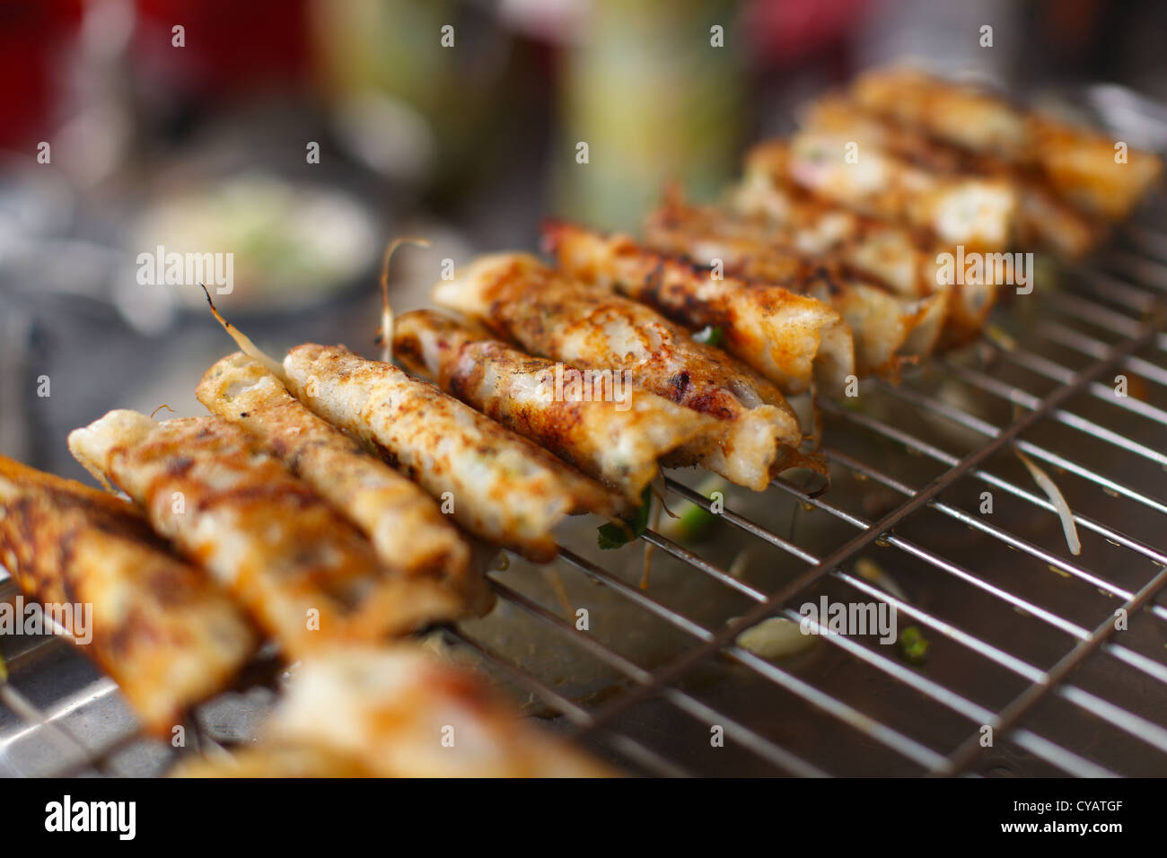 Rice flour wraps, grilling at the food stall in Asia Stock Photo Alamy