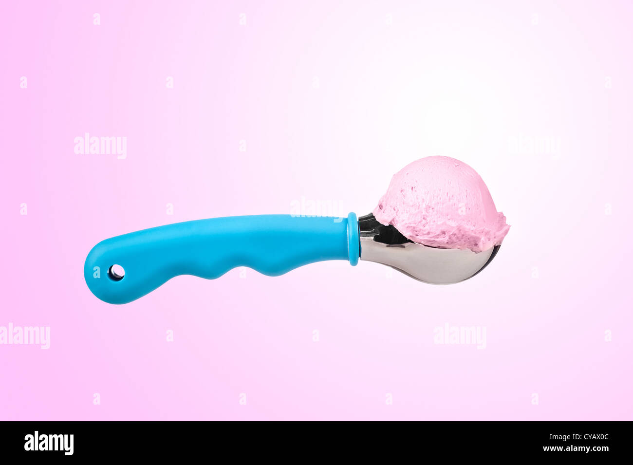 A delicious scoop of ice cream against a decorative pink and white background. Stock Photo