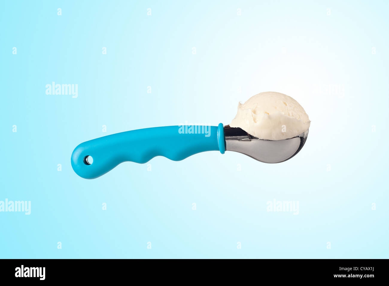 A delicious scoop of ice cream against a decorative blue and white background. Stock Photo