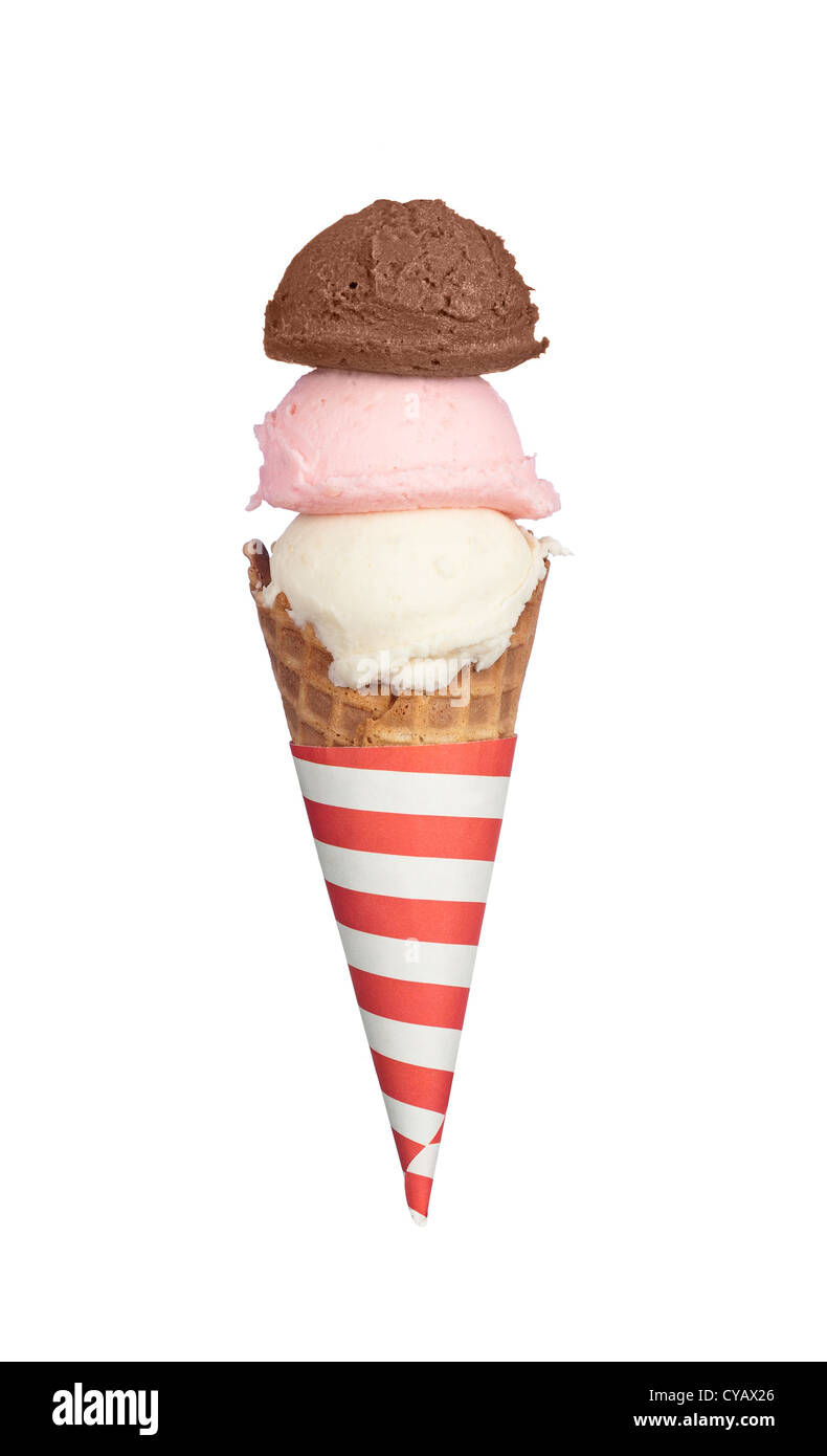 A waffle ice cream cone with chocolate, strawberry and vanilla ice cream with a red and white striped holder. Stock Photo