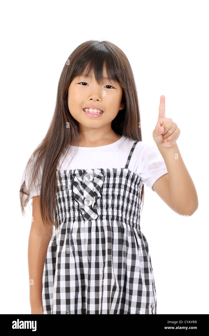 Smiling little asian girl rise hand and pointing Stock Photo - Alamy