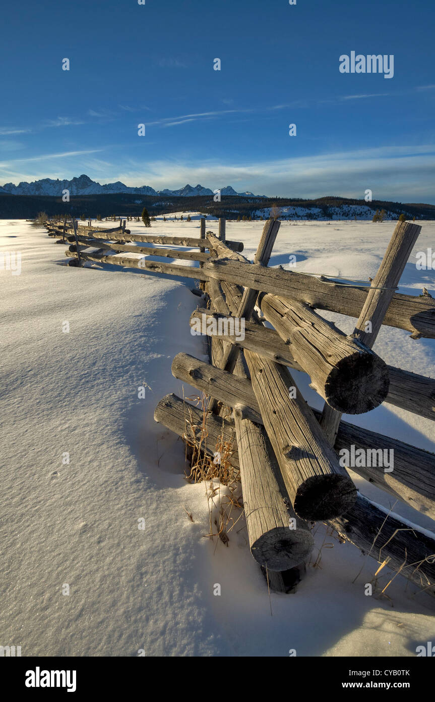 Winter snow and log fence Idaho Stock Photo