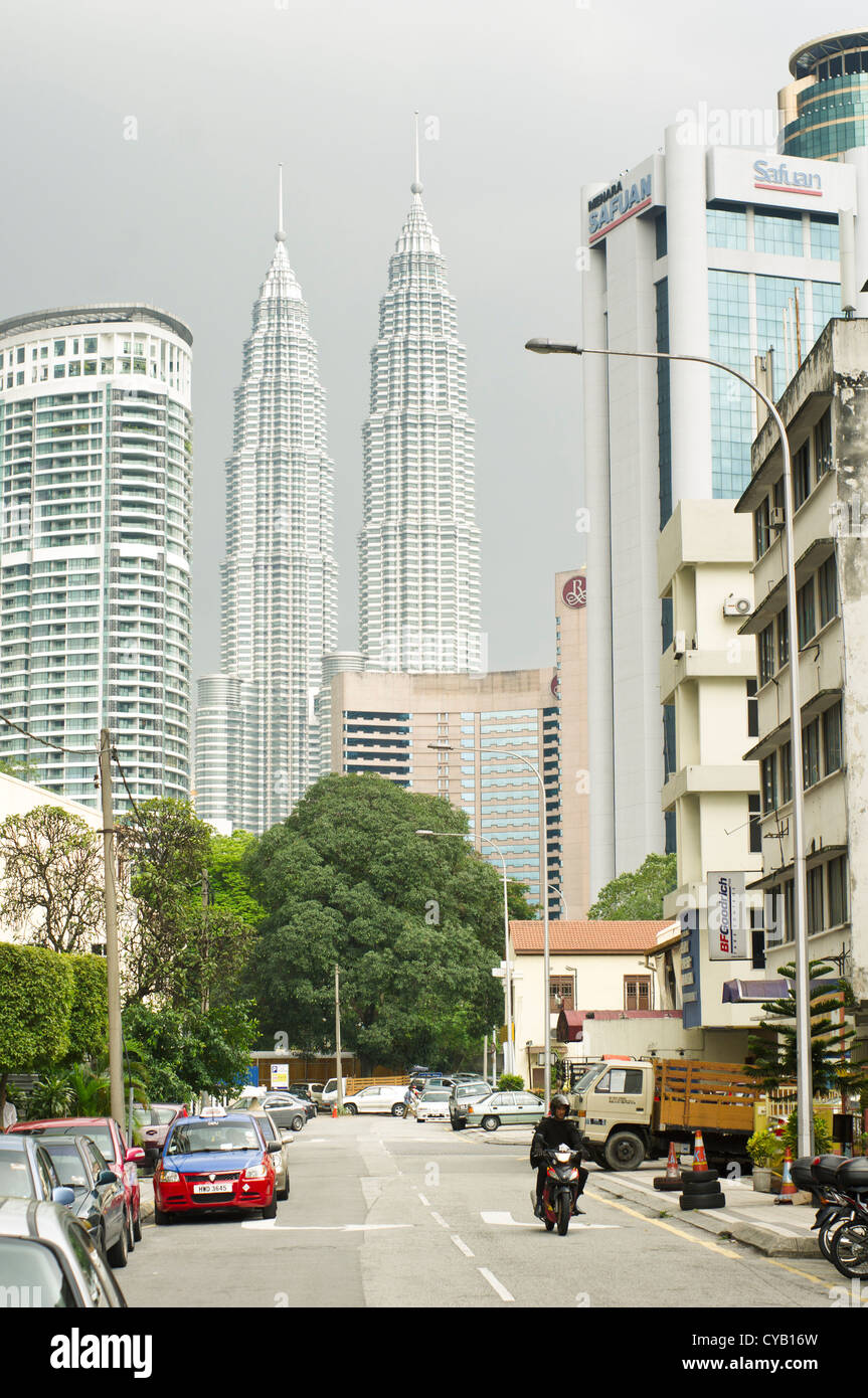 view of petronas twin towers from a street in Kuala Lumpur of Malaysia. Stock Photo