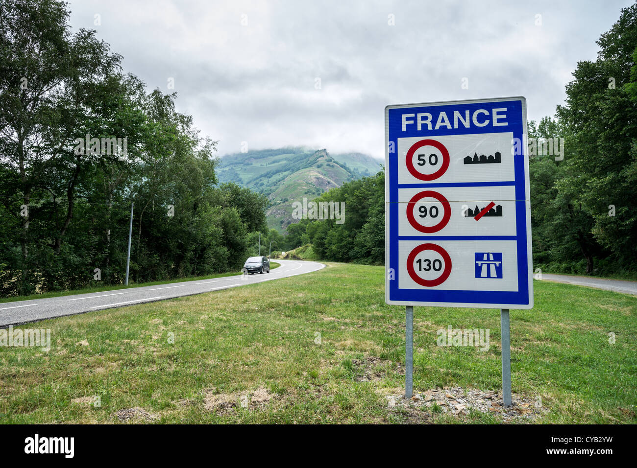 A sign with speed limits valid in France at the border of France and