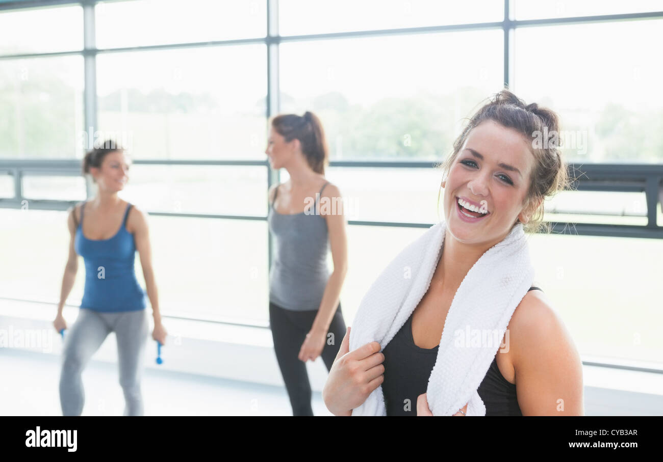 Woman smiling in fitness studio Stock Photo - Alamy
