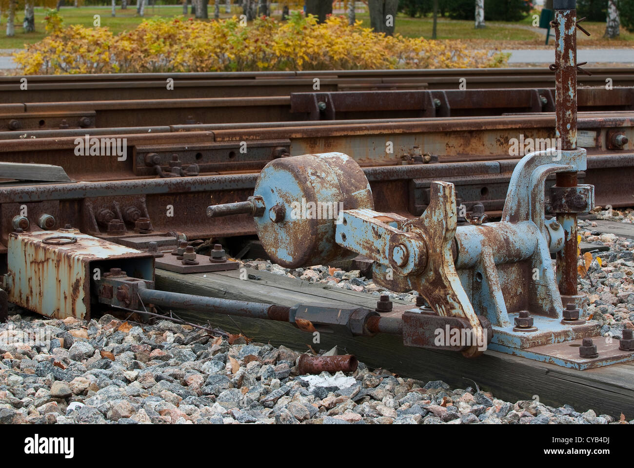 Old switch to manually switch tracks on an old railway arrangement Stock Photo