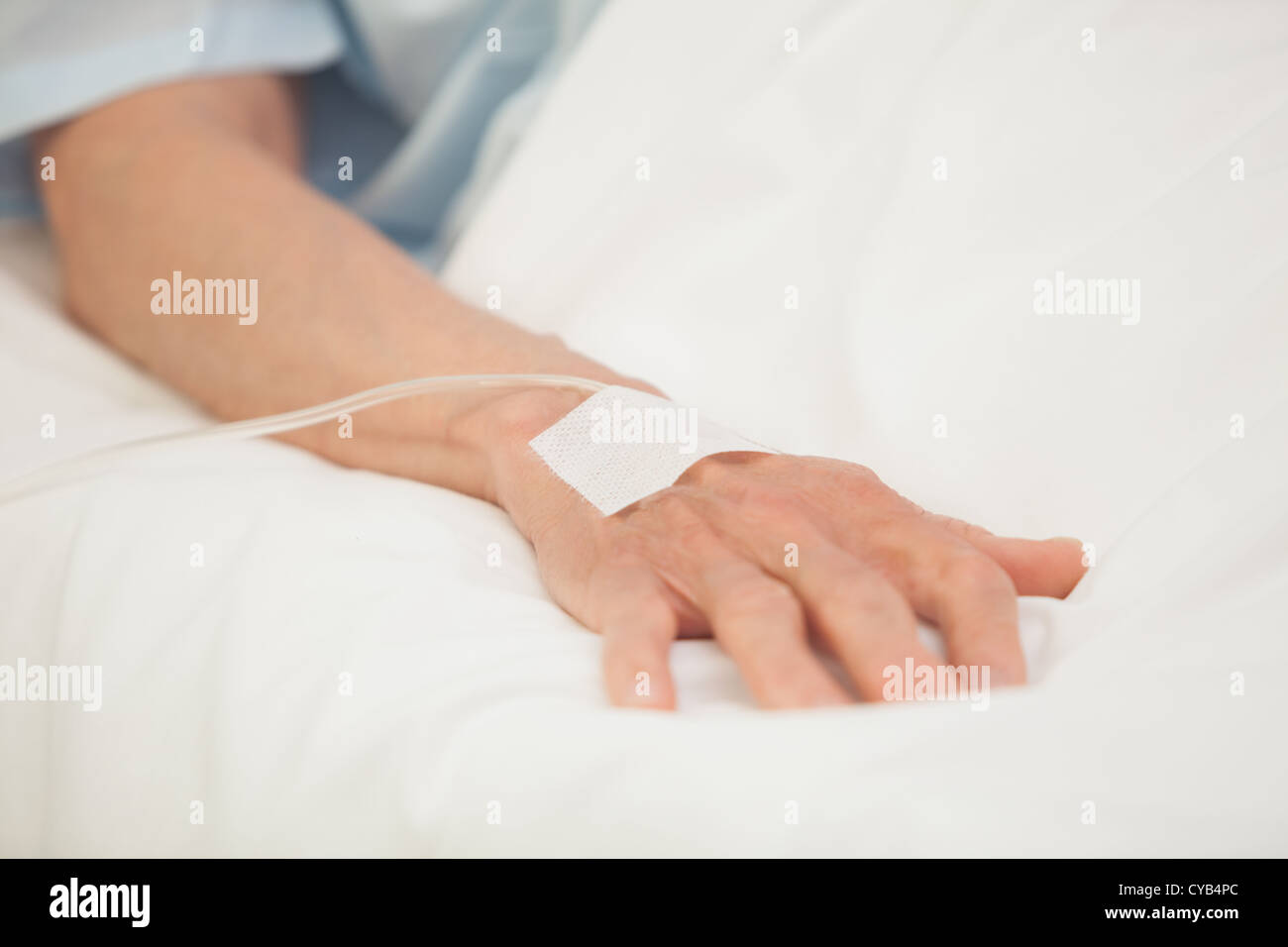 Hand with intravenous drip Stock Photo