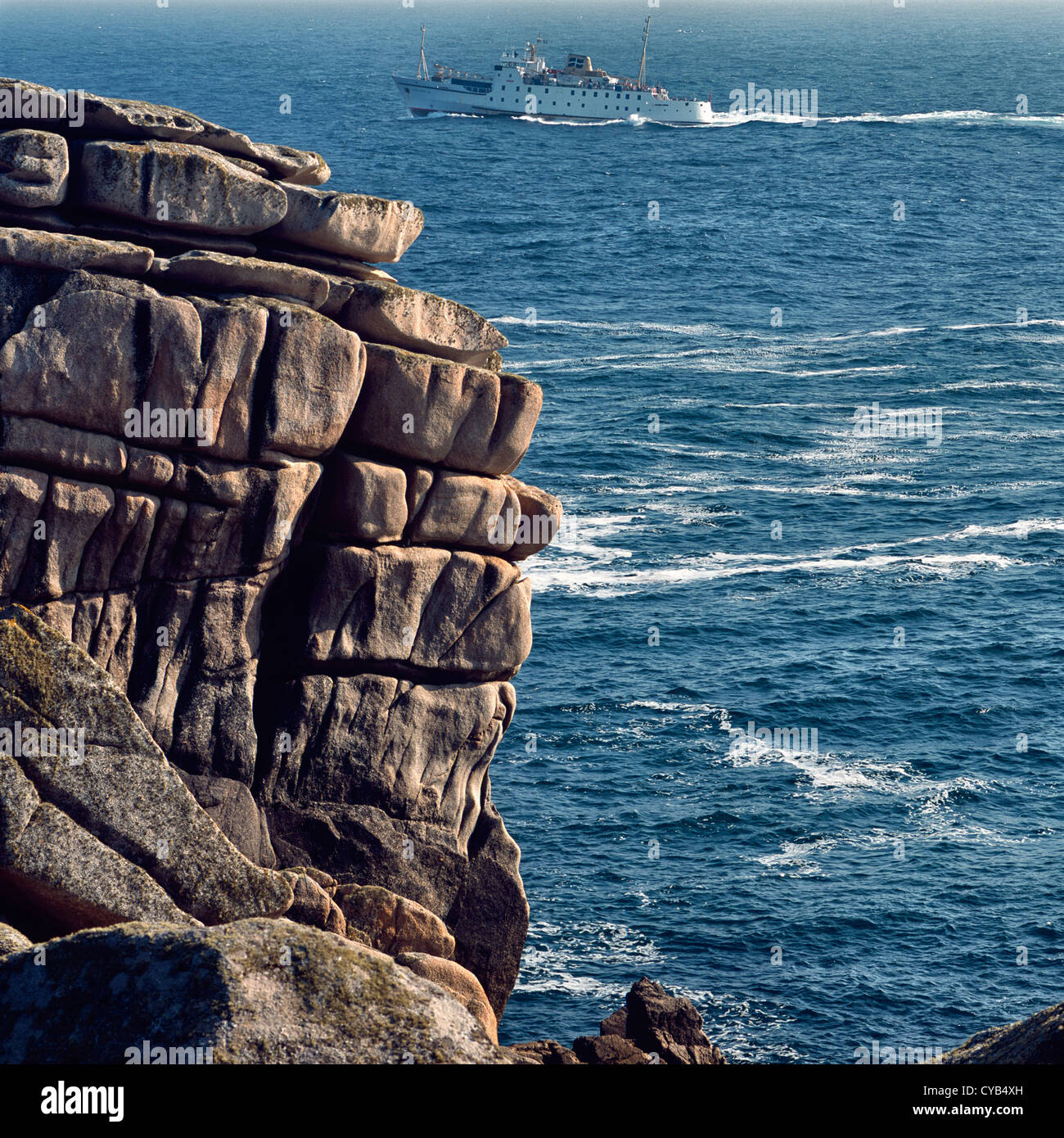 The passenger ferry 'Scillonian' sails past St Mary's, Isles of Scilly, UK, bound for Penzance, Cornwall, across a choppy sea Stock Photo