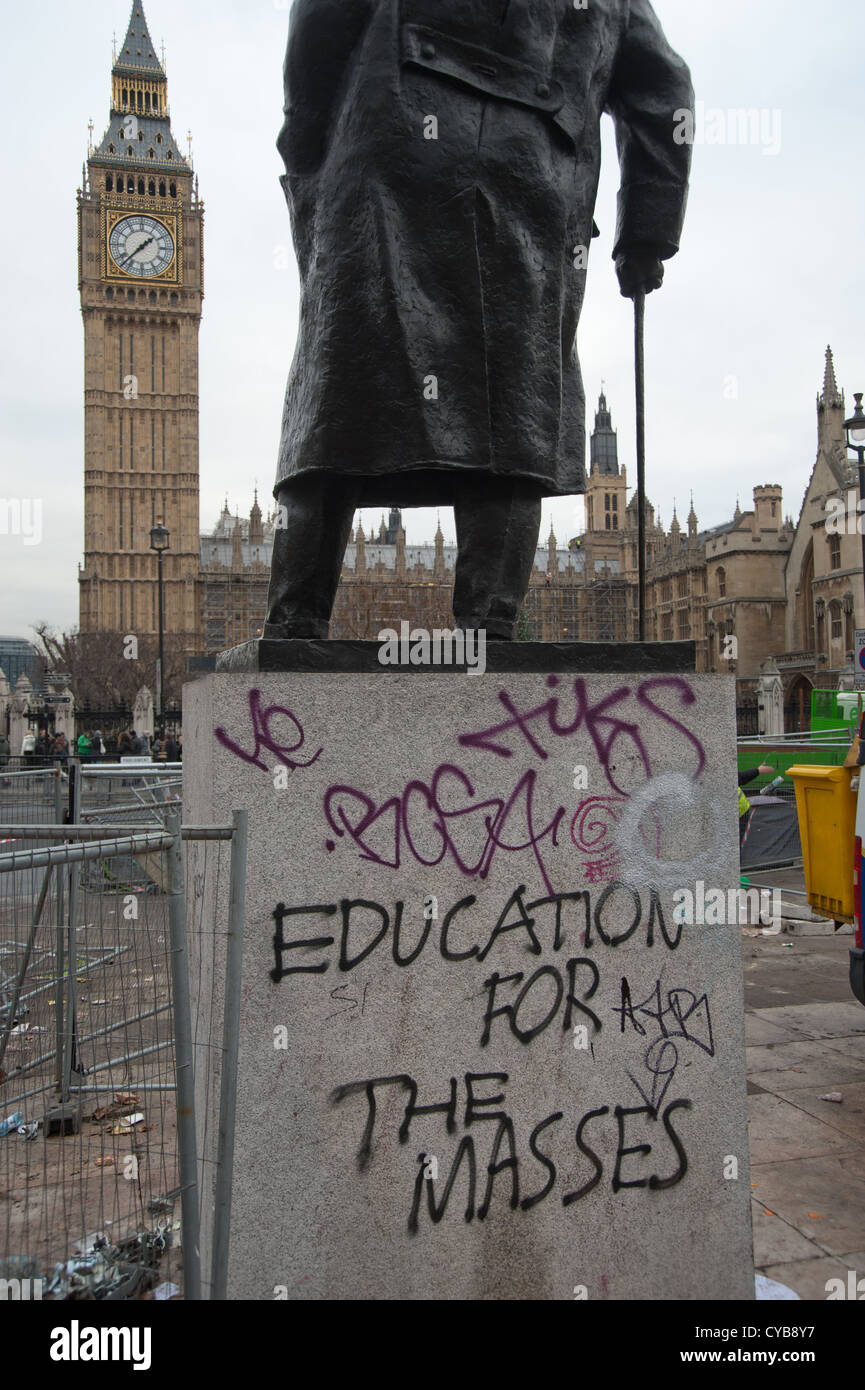 graffiti on base of Churchill statue in Parliament Square after student protest Stock Photo