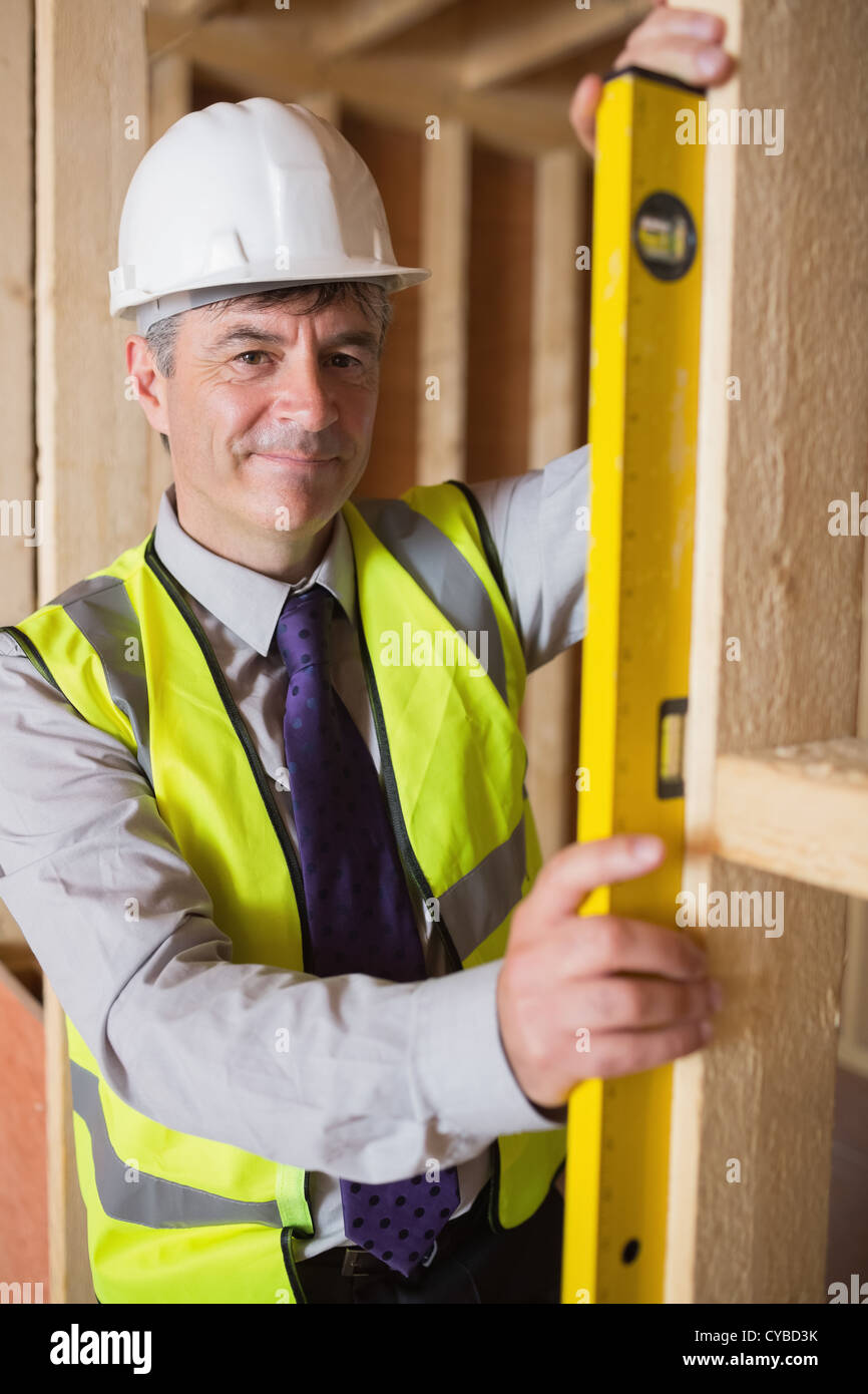 Checking Frame Man checking wooden frame Stock Photo - Alamy