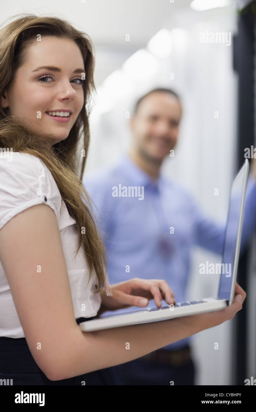 Woman with laptop smiling Stock Photo