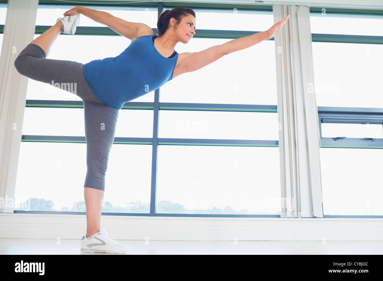 Woman in lord of the dance yoga pose Stock Photo Alamy
