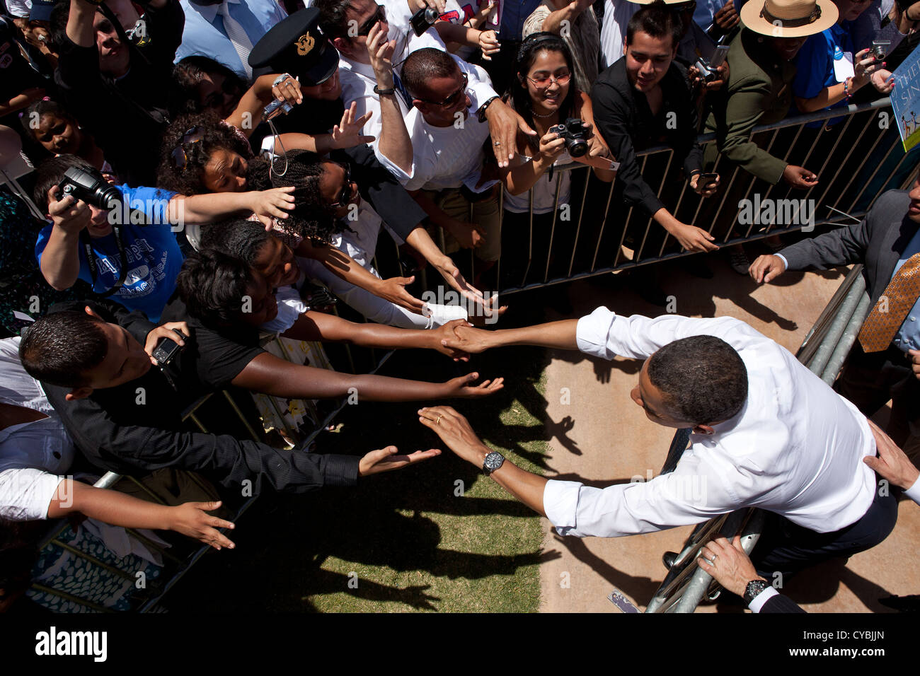US President Barack Obama shakes hands with people in the crowd following his remarks on immigration reform at Chamizal National Memorial Park May 10, 2011 in El Paso, Texas. Stock Photo
