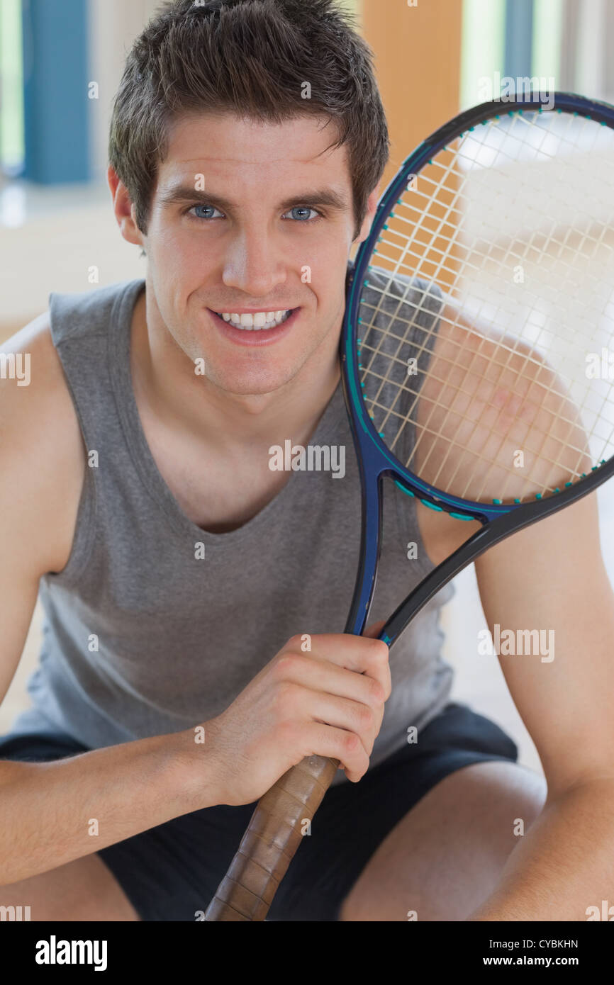 Man holding tennis racket Stock Photo Alamy