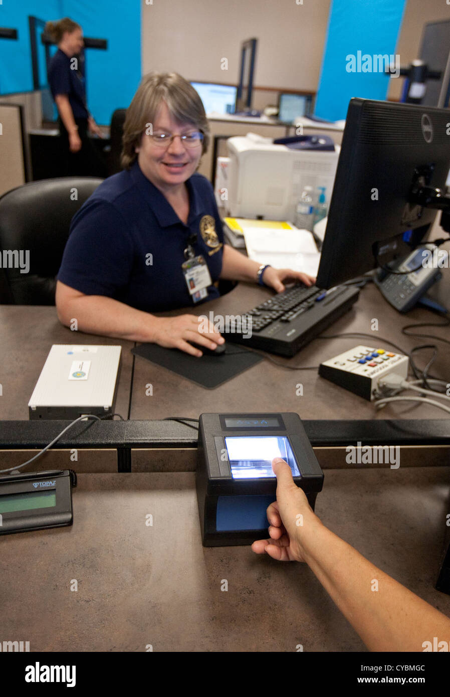 Customer in to renew driver's license gets finger-printed and completes eye  exam at the Texas Department of Public Safety Stock Photo - Alamy