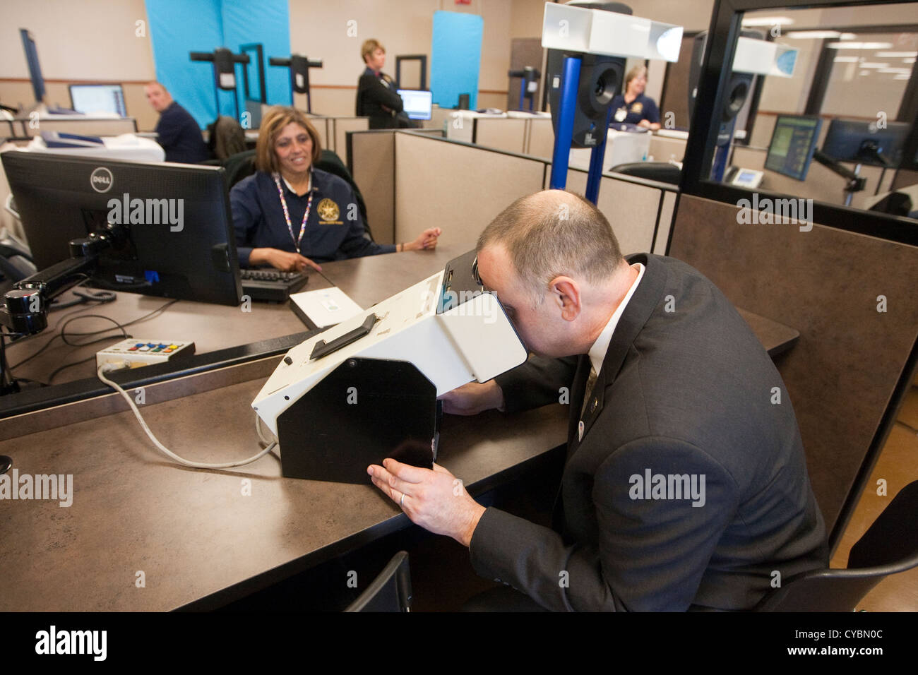 Customer in to renew driver's license gets finger-printed and completes eye  exam at the Texas Department of Public Safety Stock Photo - Alamy