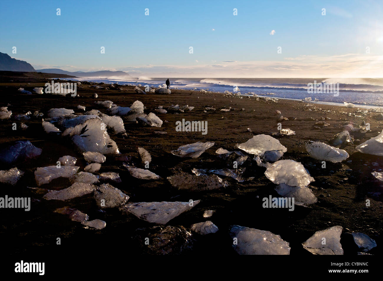 Icebergs on volcanic sand beach at Jokulsarlon Iceland Stock Photo
