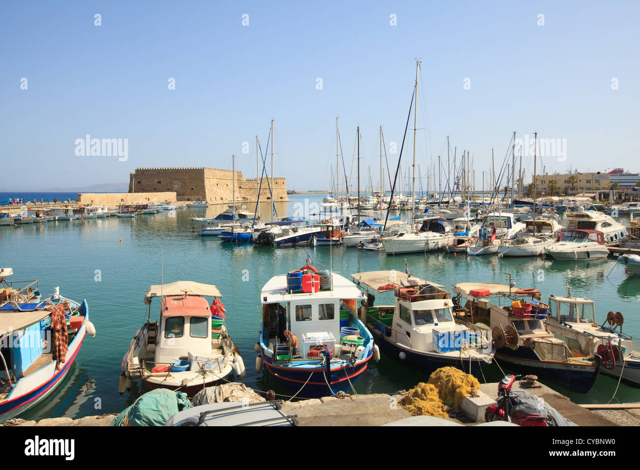 Venetian Fortress and fishing boats at Heraklion Harbour on the Greek island of Crete, Greece. Stock Photo